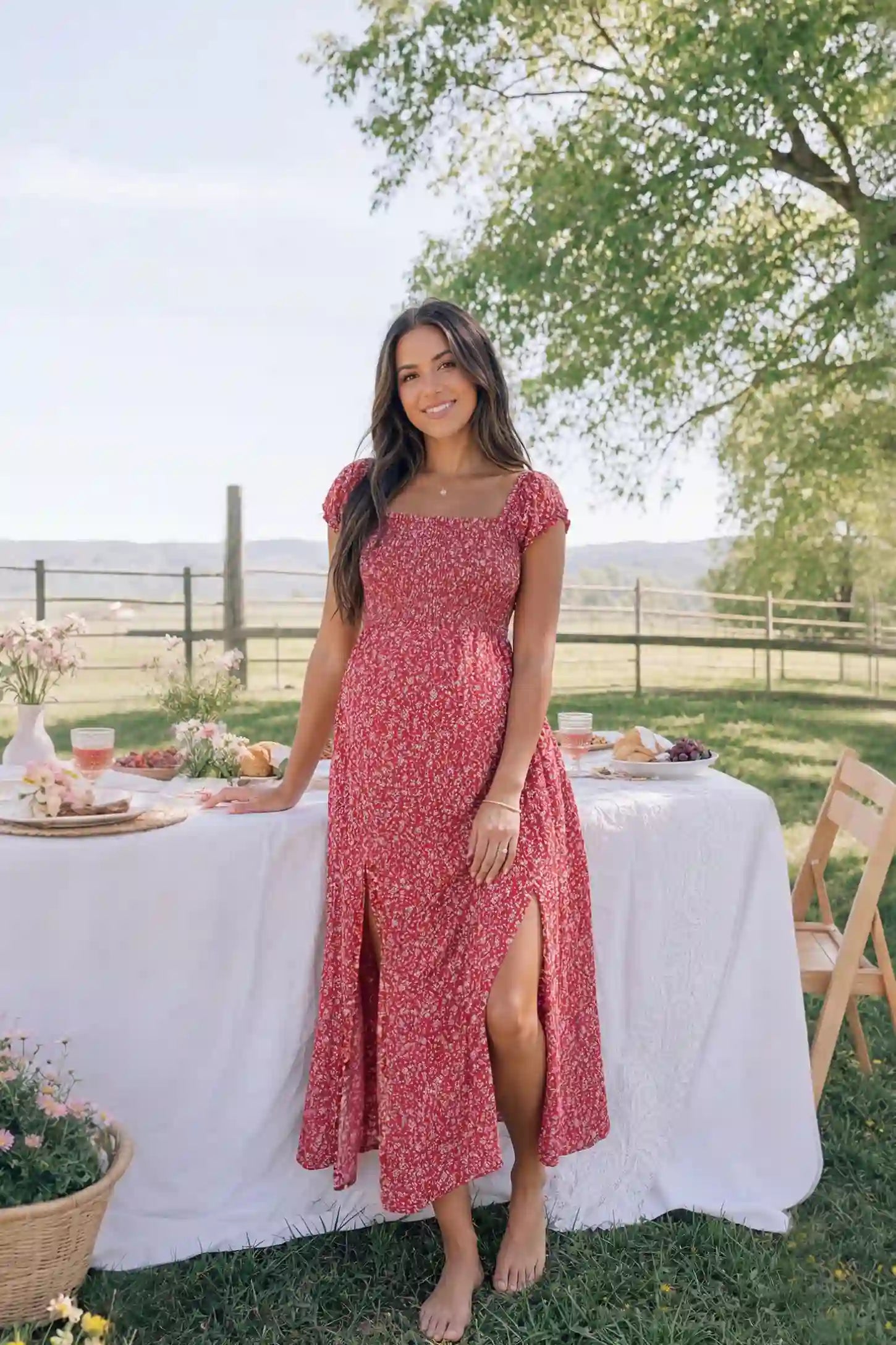 Floral Off-Shoulder Smocked Bodice Maxi Maternity Dress Floral off-shoulder smocked bodice maxi maternity dress in red featuring smocked neckline in front view on a pregnant model