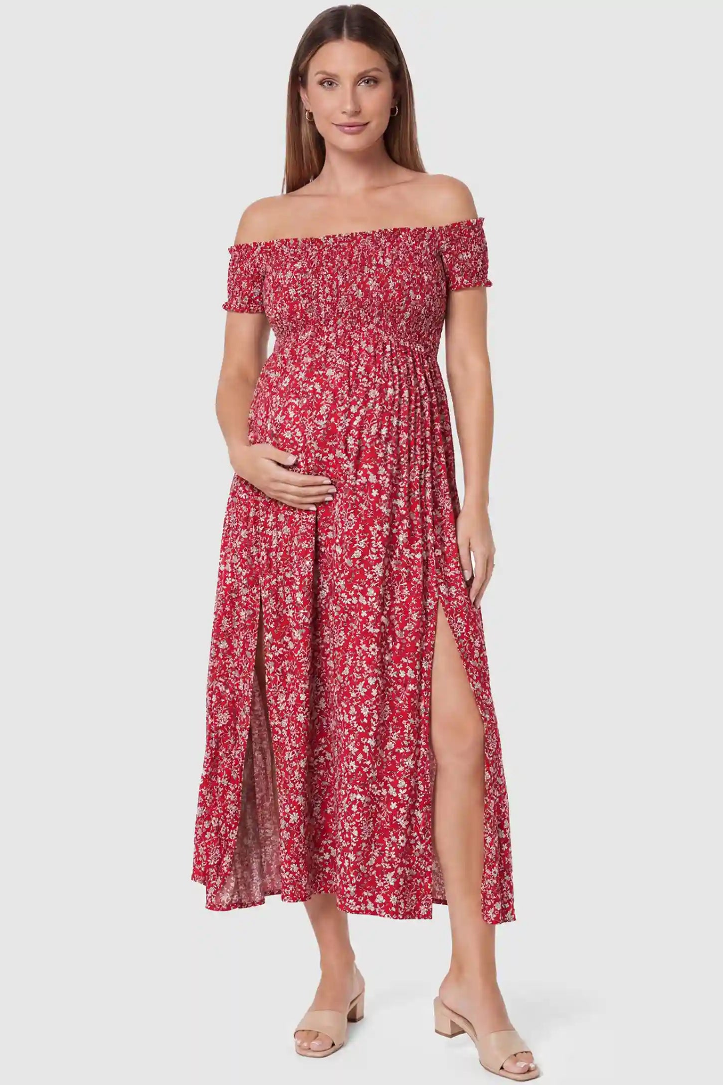 Floral Off-Shoulder Smocked Bodice Maxi Maternity Dress Floral off-shoulder smocked bodice maxi maternity dress in red featuring smocked neckline in front view on a pregnant model