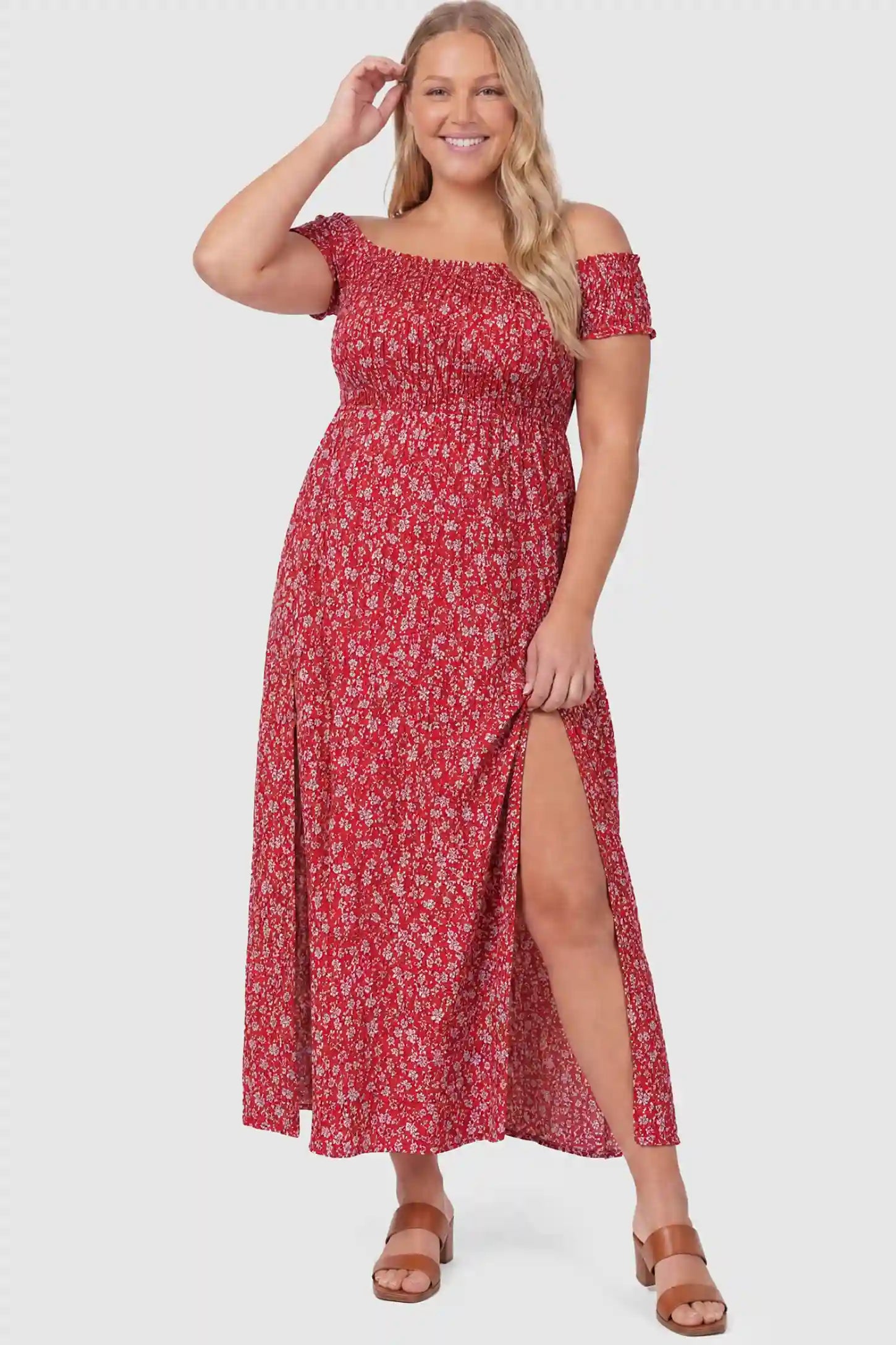Floral Off-Shoulder Smocked Bodice Maxi Maternity Dress Floral off-shoulder smocked bodice maxi maternity dress in red featuring smocked neckline in front view on a plus-size model