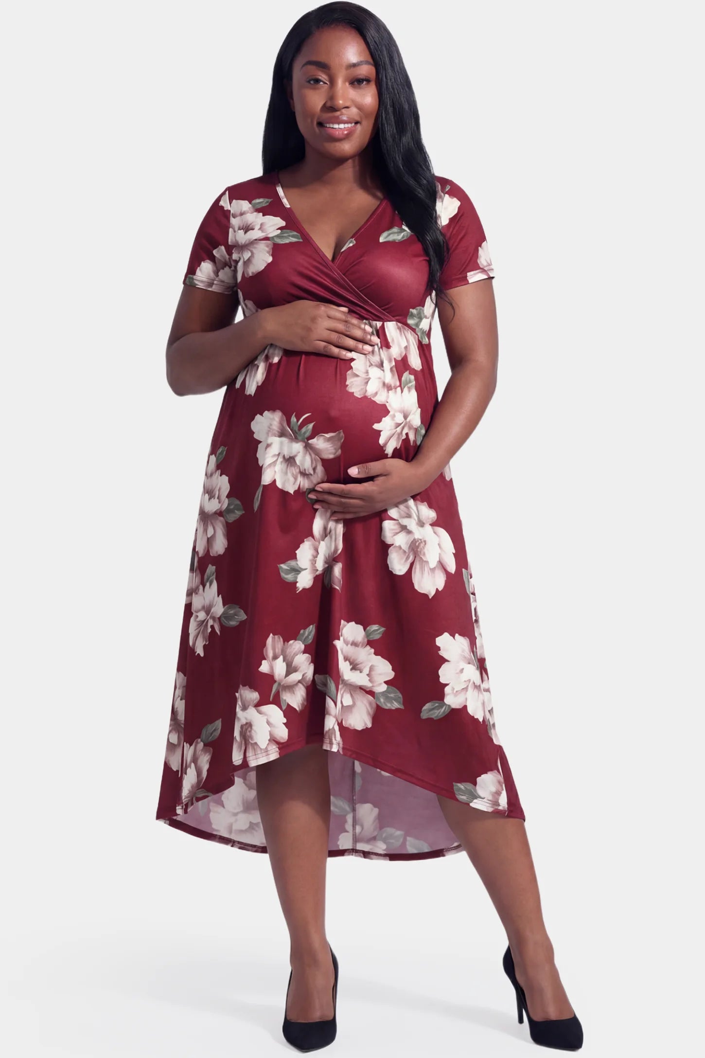 Floral V-Neck Wrap High-Low Maxi Maternity Dress Floral V-neck wrap high-low maxi maternity dress in wine red floral featuring V-neck wrap-style front in front view on a plus-size model