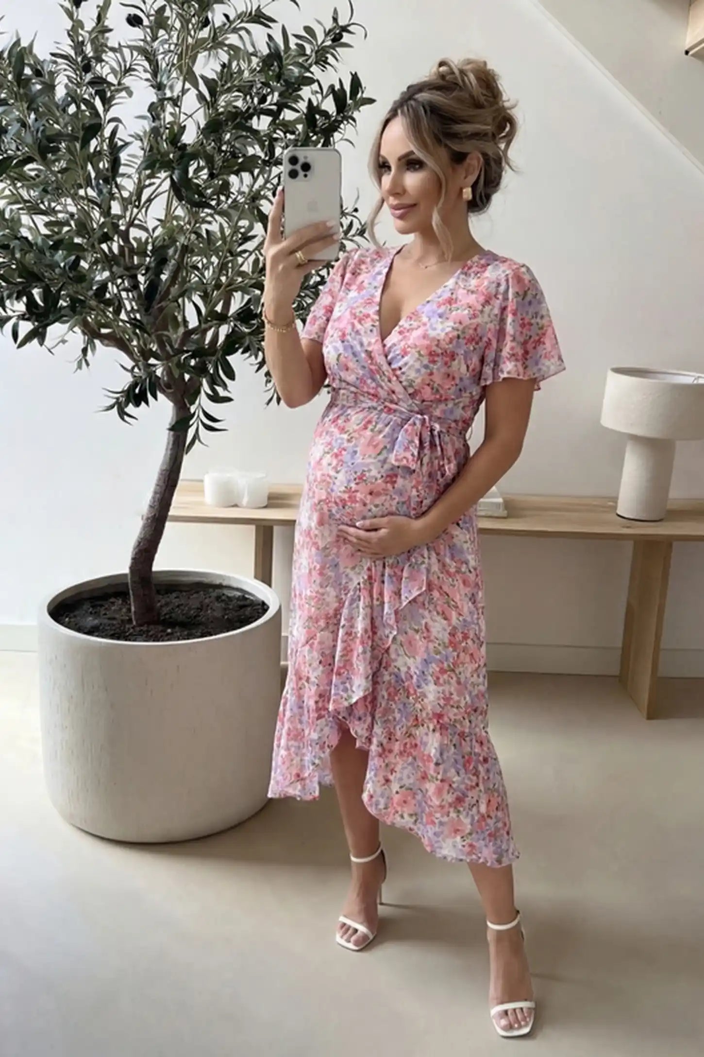 Floral V-Neck Ruffled Hem Midi Maternity Dress Floral V-neck ruffled hem midi maternity dress in pink with feminine floral print, on UGC model