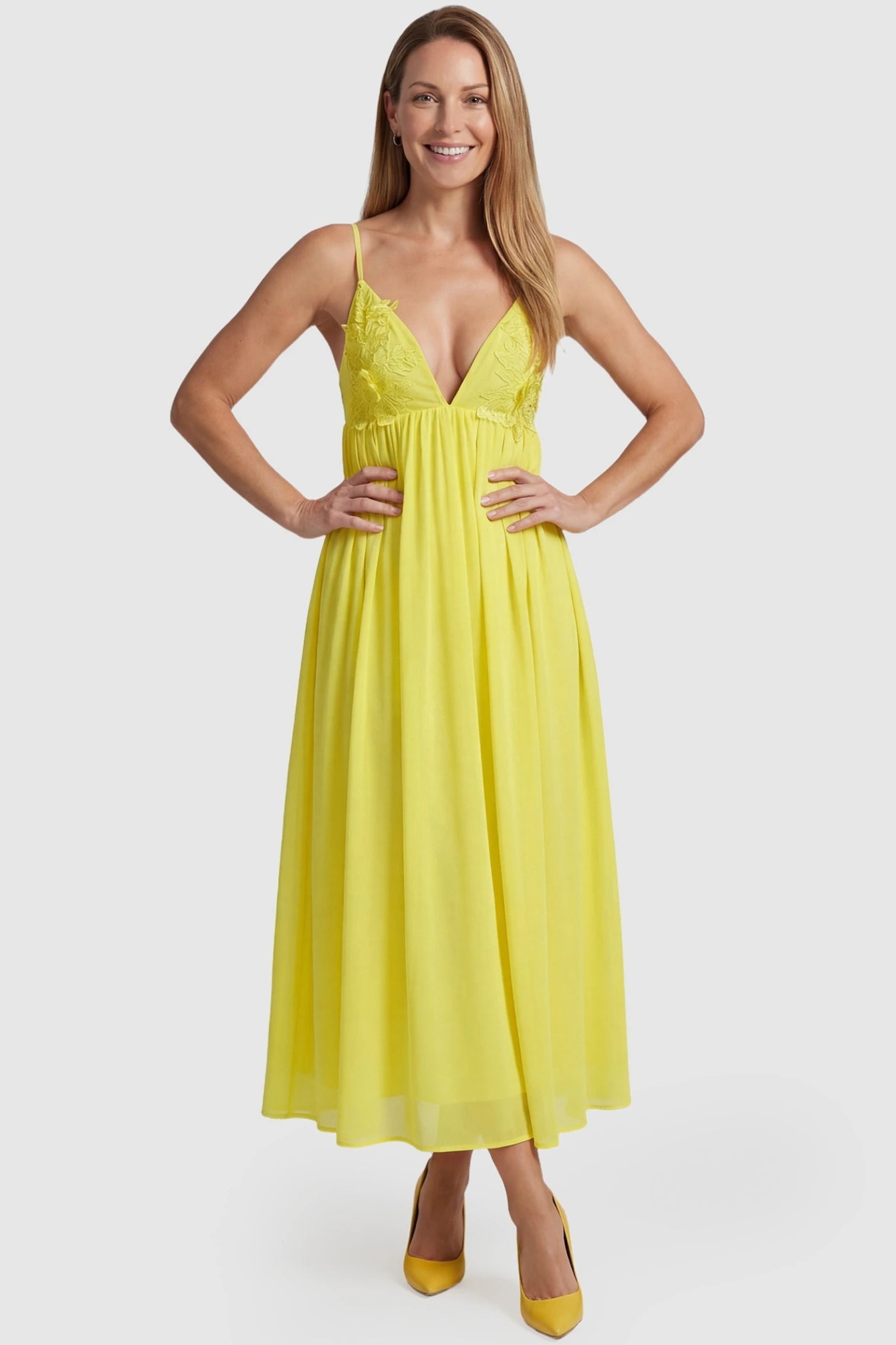 Yellow Floral Embroidered Chiffon Maternity Maxi Dress Floral Embroidered Chiffon Maternity Maxi Dress in Yellow featuring 3D floral accents on a non-pregnant model front view.