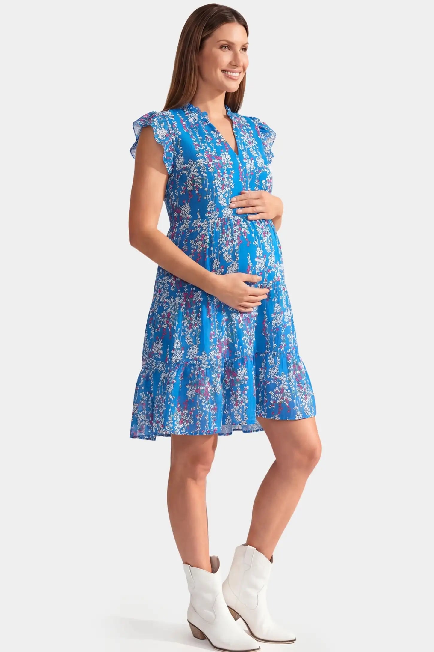Floral V-Neck A-Line Short Maternity Dress Floral V-Neck A-Line Short Maternity Dress in blue featuring flutter sleeves in full body side view on a pregnant model
