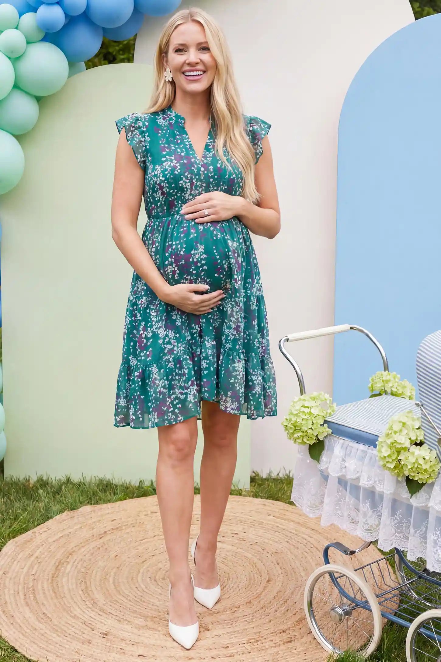 Floral V-Neck A-Line Short Maternity Dress Floral V-neck A-line short maternity dress in green with airy chiffon flow, on editorial lifestyle model
