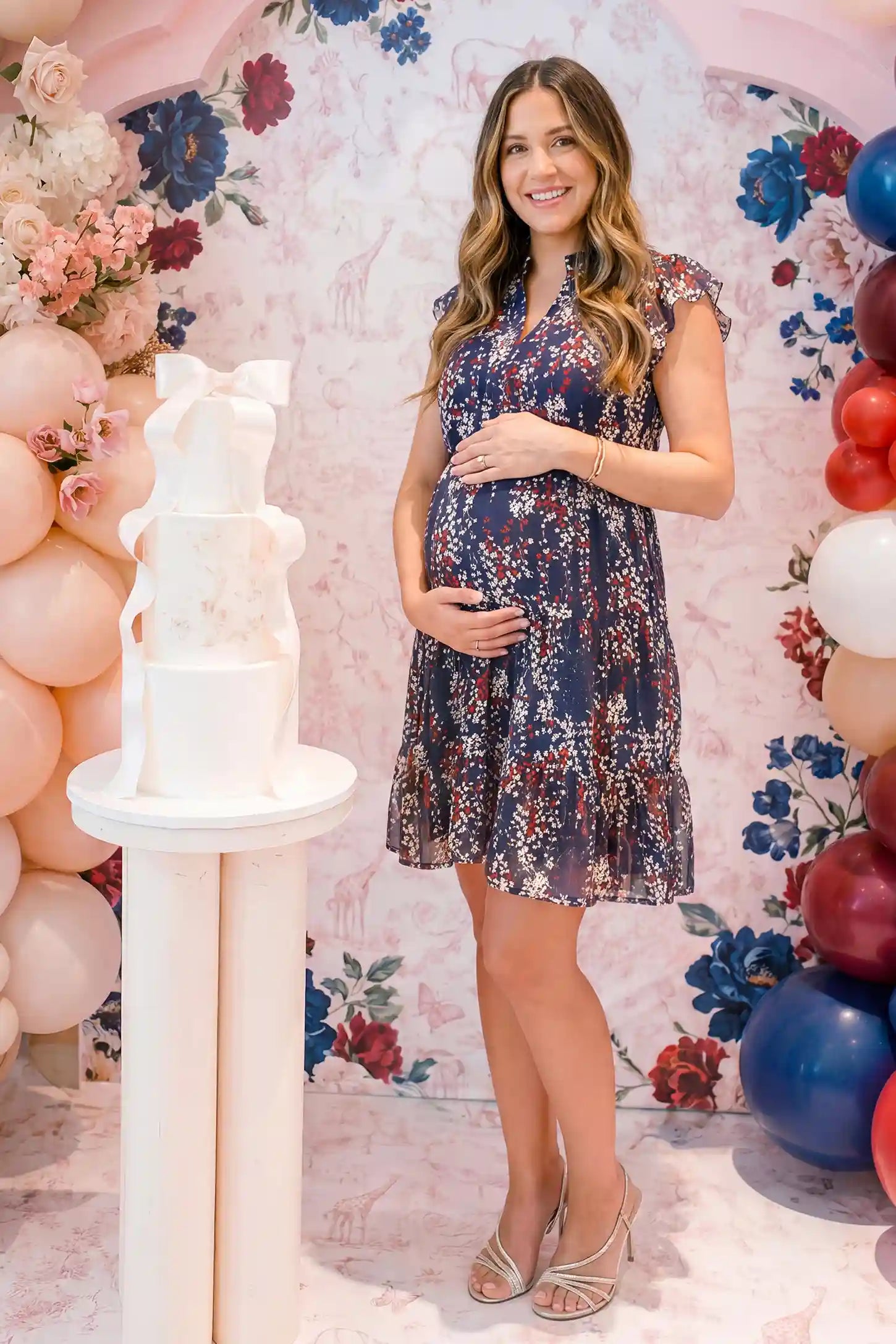 Floral V-Neck A-Line Short Maternity Dress Floral V-neck A-line short maternity dress in navy with airy chiffon flow, on editorial lifestyle model