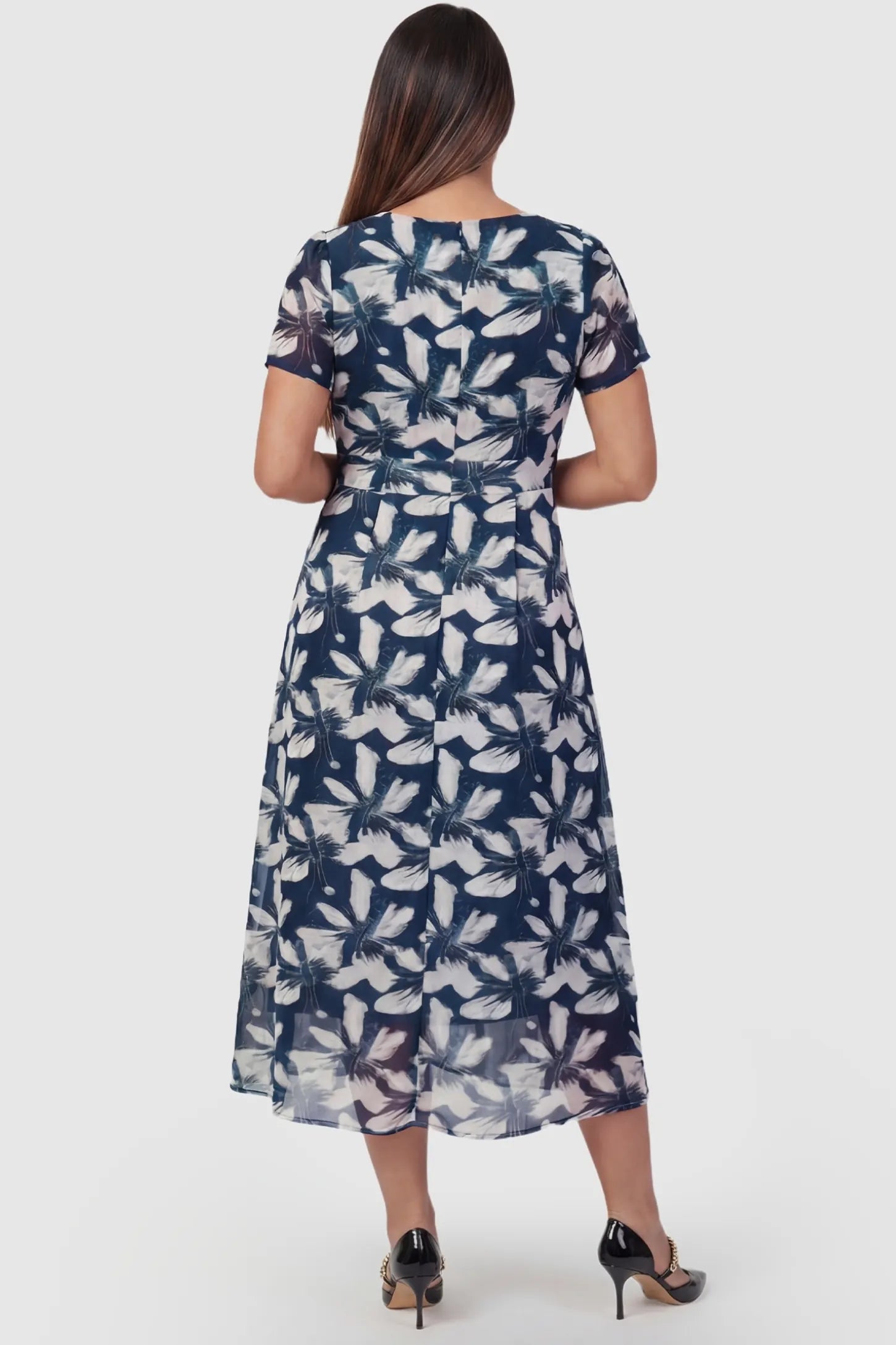Floral Print Square Neck Fit and Flare Maternity Midi Dress Floral Print Square Neck Fit and Flare Maternity Midi Dress in blue featuring short sleeves on a pregnant model, back view.