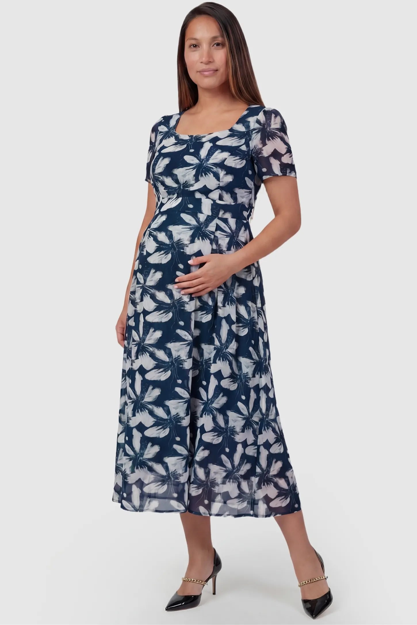 Floral Print Square Neck Fit and Flare Maternity Midi Dress in blue featuring a swing skirt on a pregnant model, front view.
