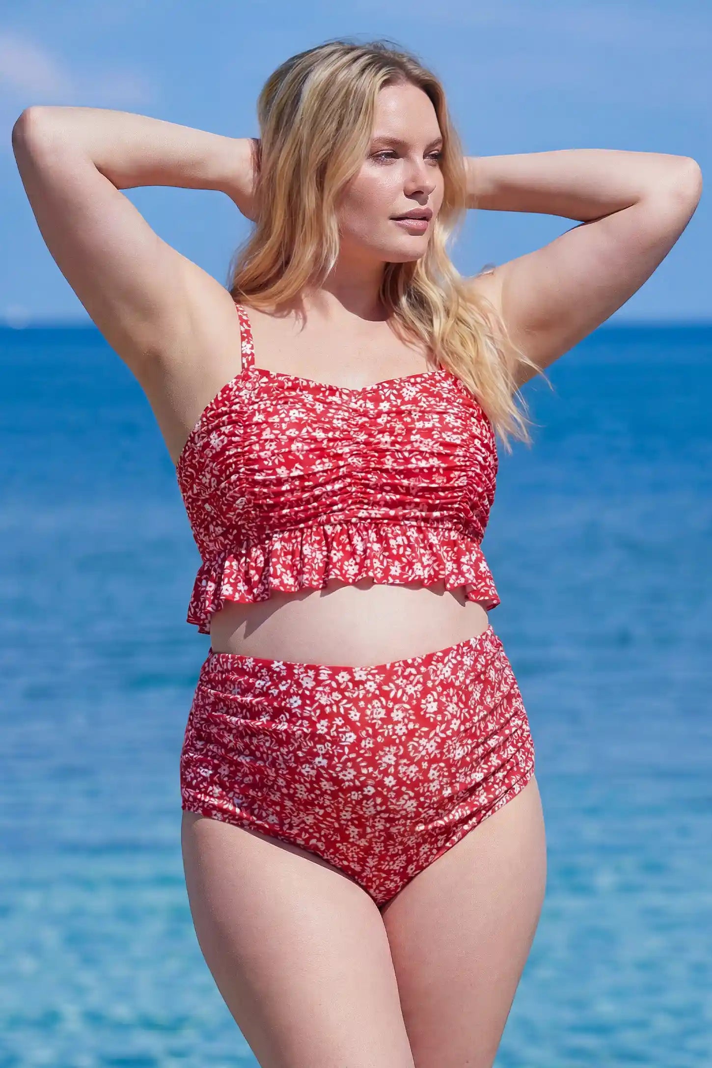 Floral Ruched Ruffle Hem Maternity Bikini Set Floral Ruched Ruffle Hem Maternity Bikini Set in Red featuring ruched detailing and a floral print on a plus size pregnant model, front view.