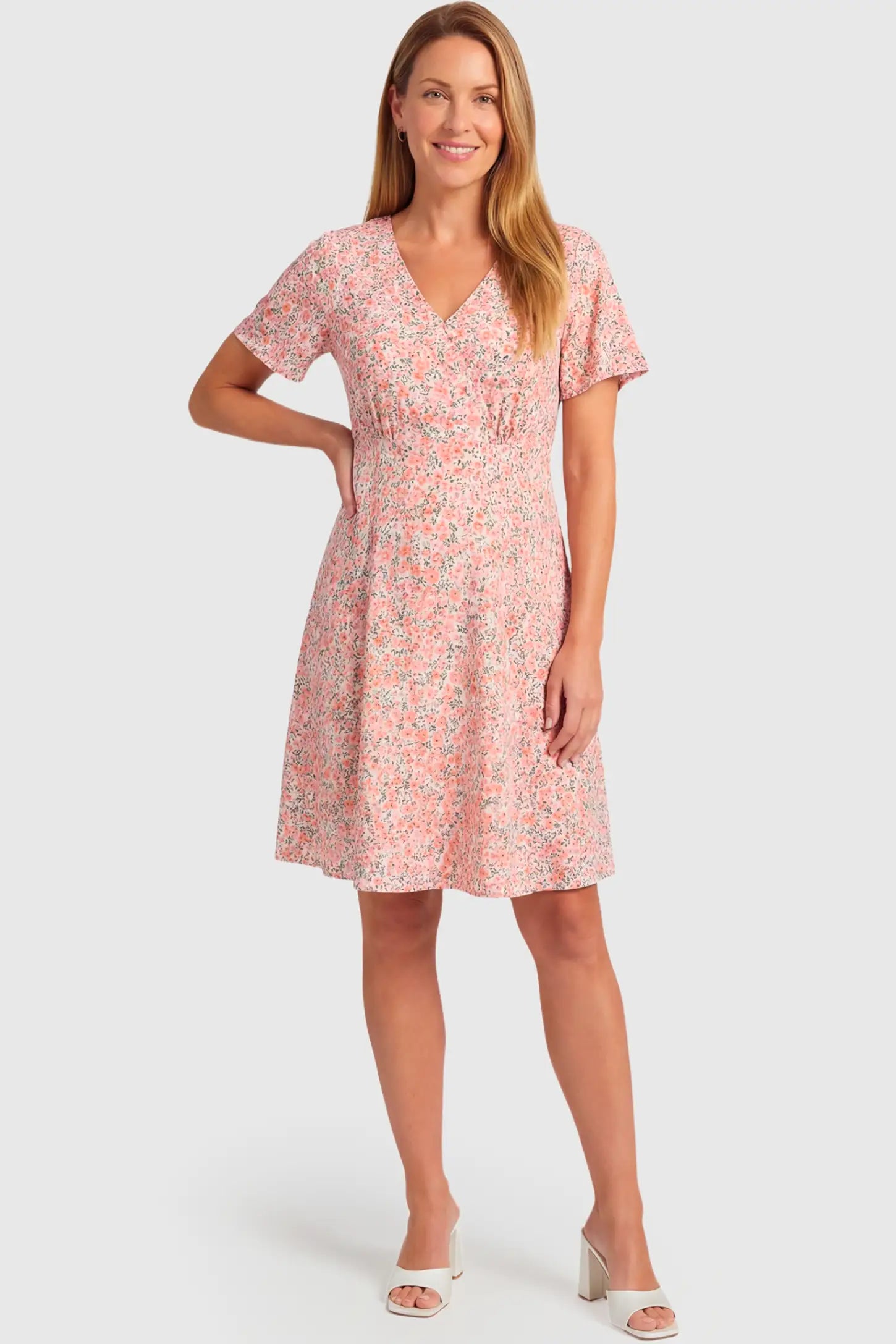 Short Sleeve A-Line Maternity Short Dress Short Sleeve A-Line Maternity Short Dress in pink floral featuring V-neck and empire waist on a non pregnant model.