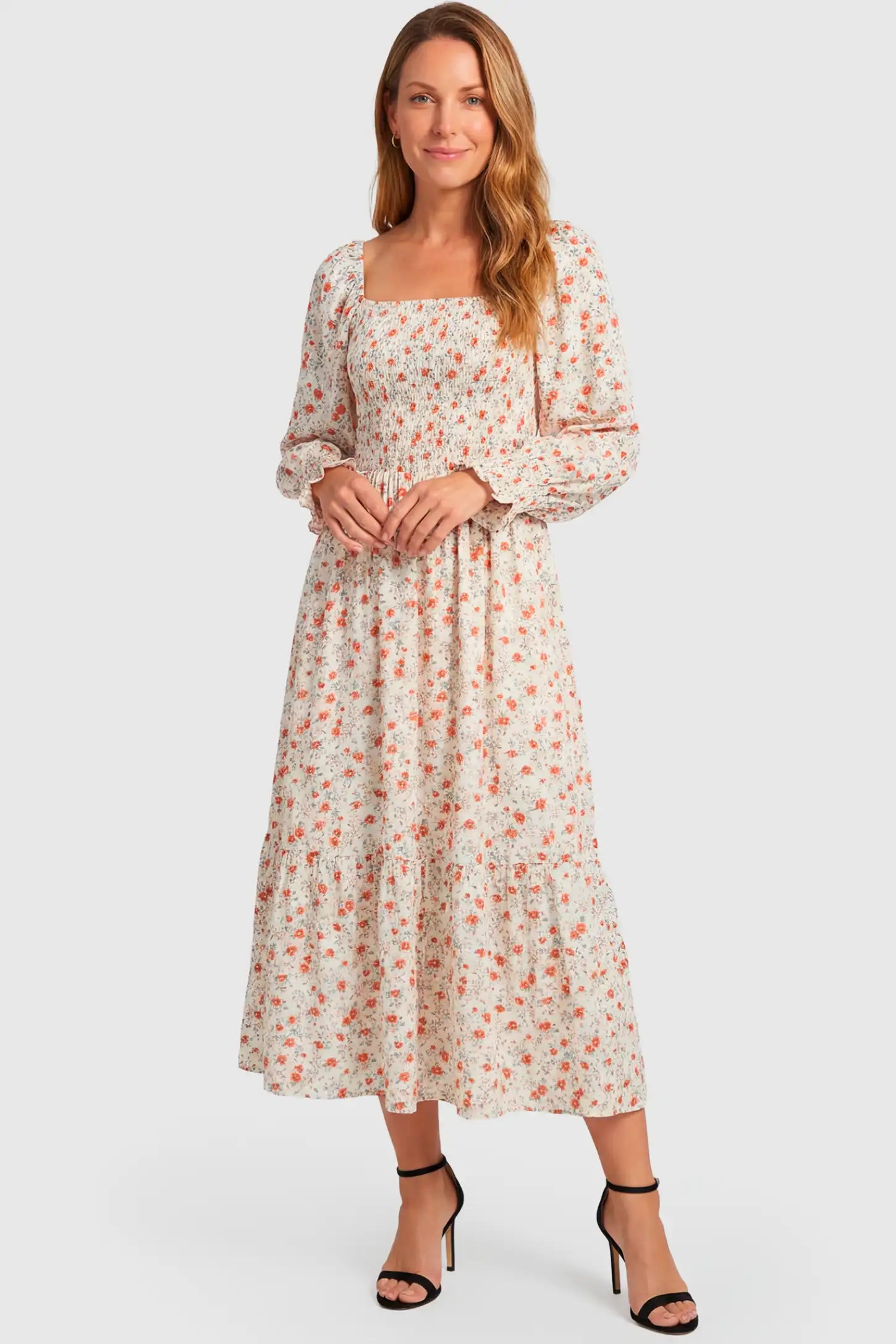 Floral Smocked Tiered Maternity Midi Dress Floral Smocked Tiered Maternity Midi Dress in white floral print featuring square neckline, puff sleeves, and tiered midi skirt on postpartum model, front view