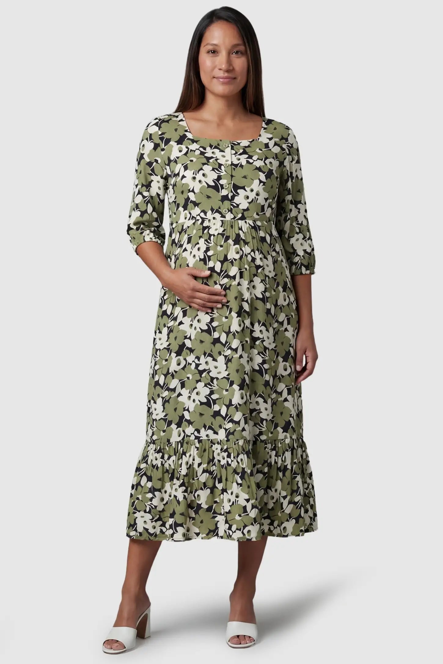 Floral Square Neck Tiered Midi Maternity Dress in green floral featuring a button-down bodice on a front-facing pregnant model.
