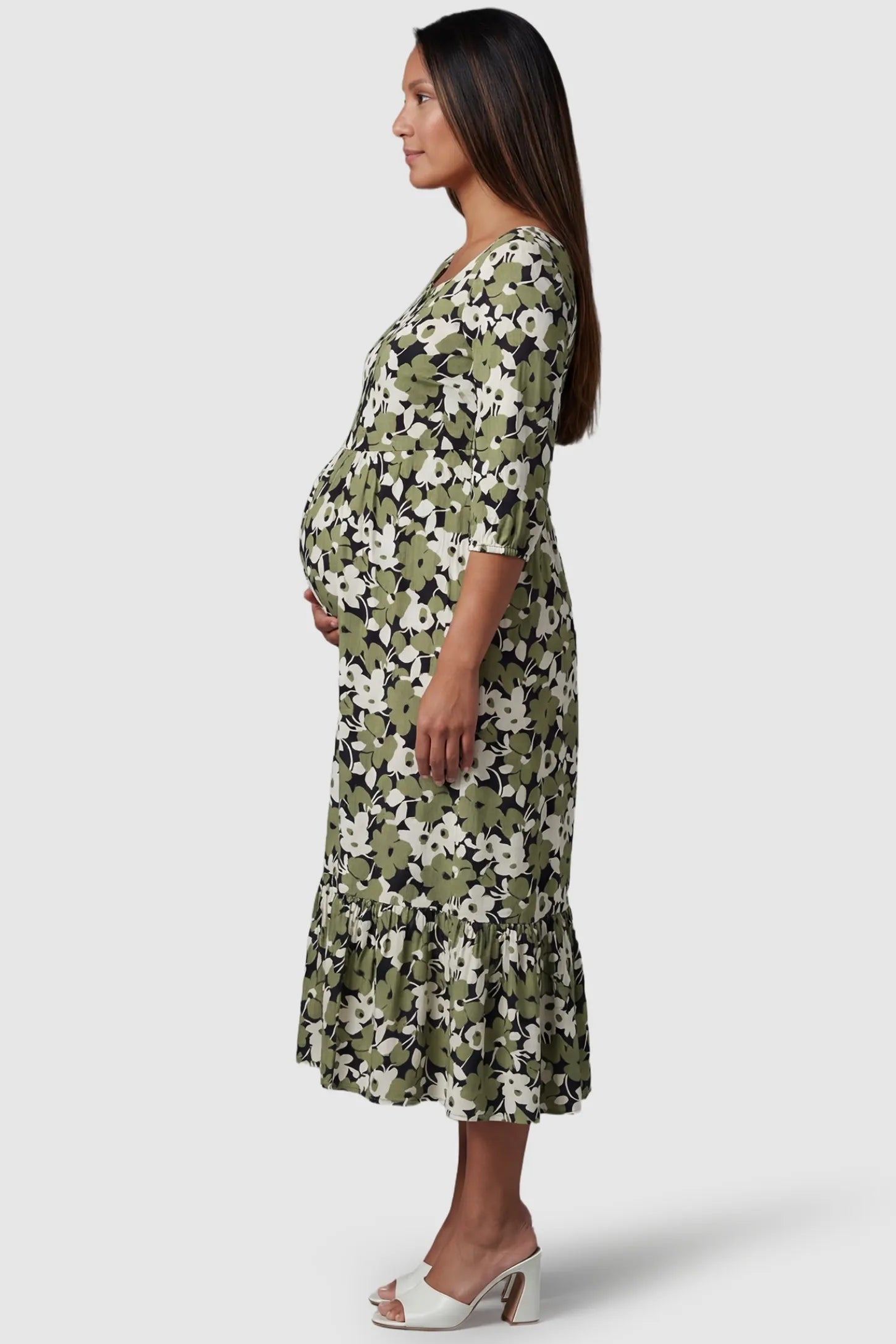 Floral Square Neck Tiered Midi Maternity Dress in green floral featuring 3/4 sleeves on a side-profile pregnant model.