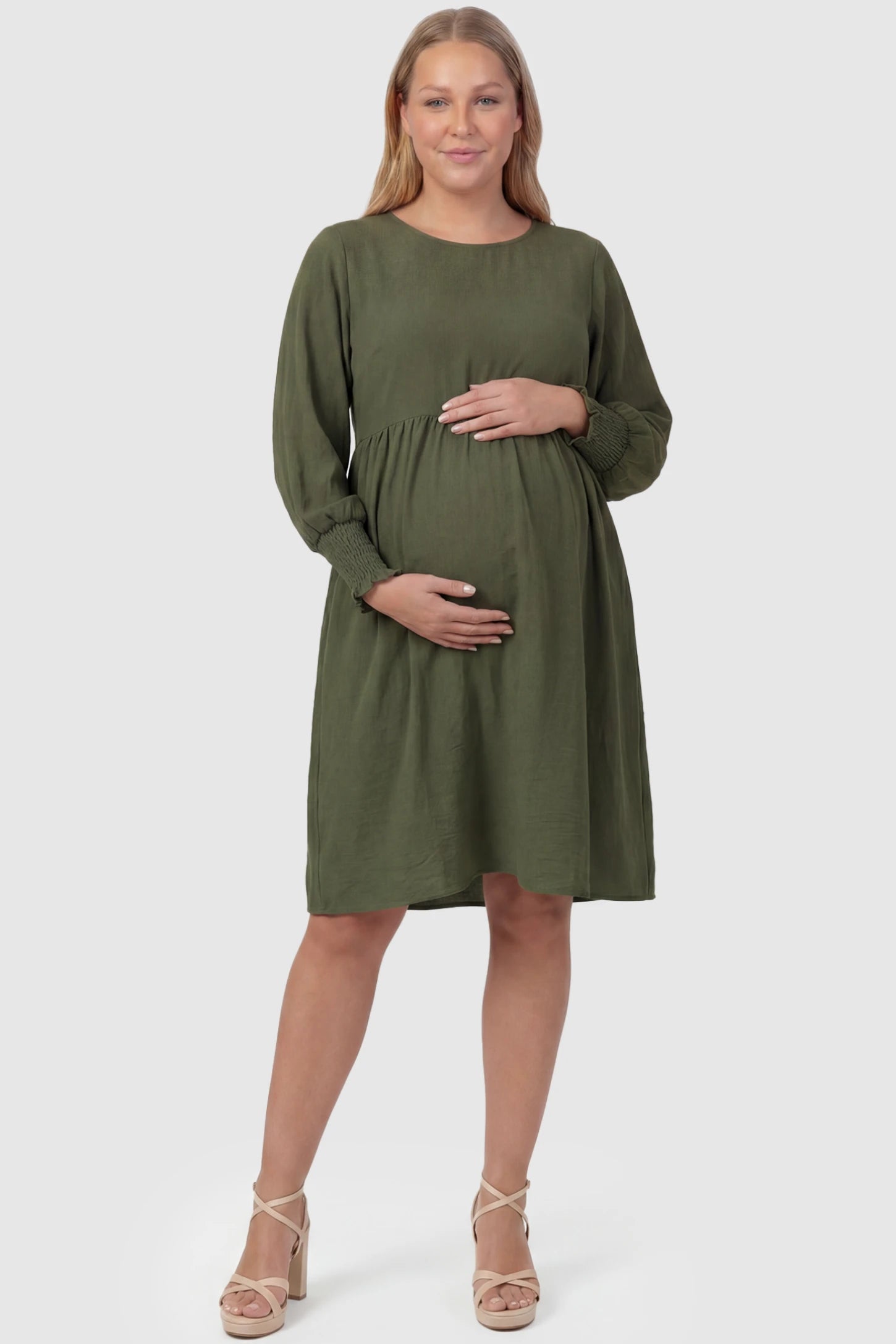 Balloon Sleeve Empire Waist Maternity Midi Dress Balloon Sleeve Empire Waist Maternity Midi Dress in army green featuring smocked elastic cuff sleeves and soft drape on a plus size pregnant model, front view.