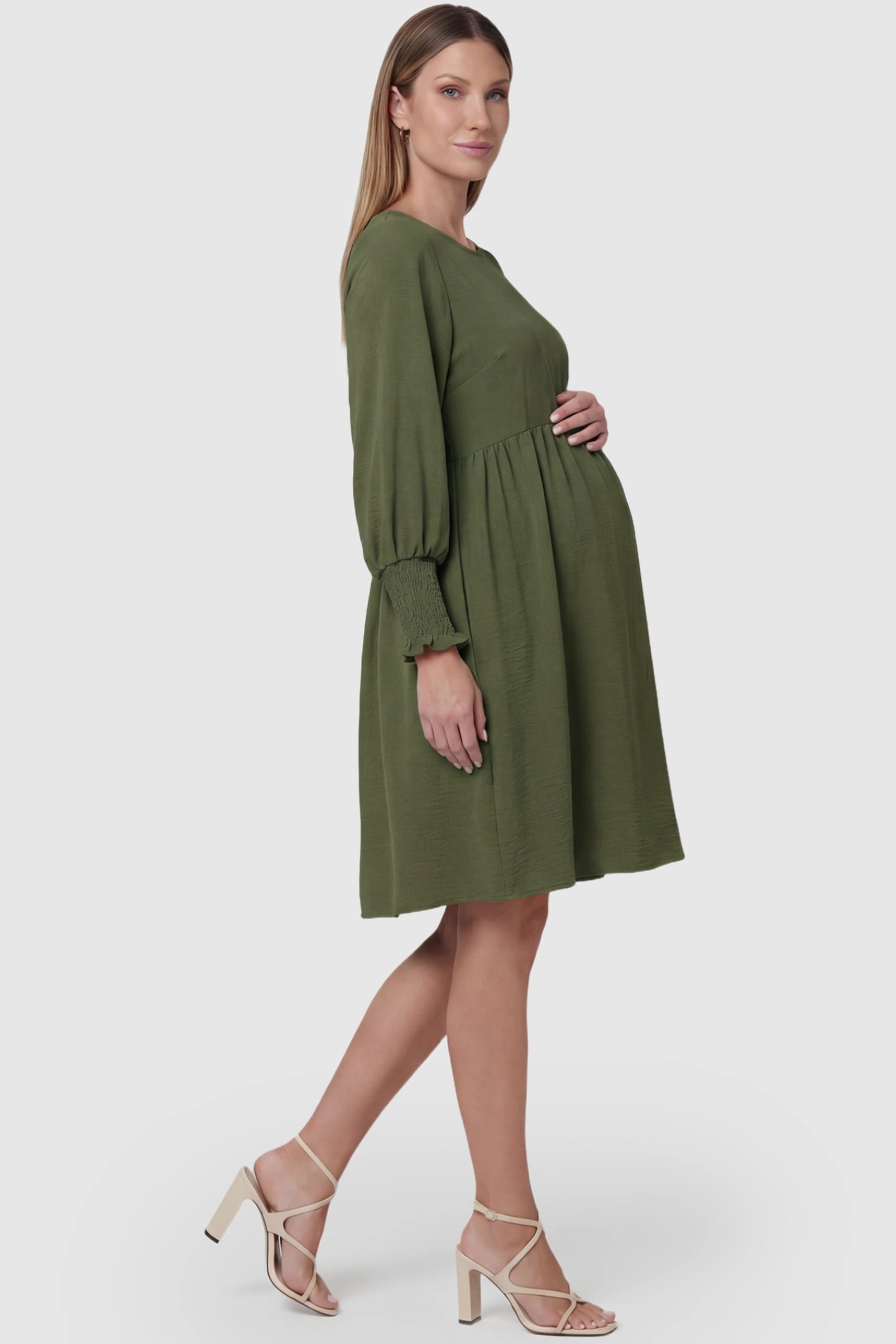 Balloon Sleeve Empire Waist Maternity Midi Dress in army green featuring smocked elastic cuff sleeves and soft drape on a pregnant model, side view.