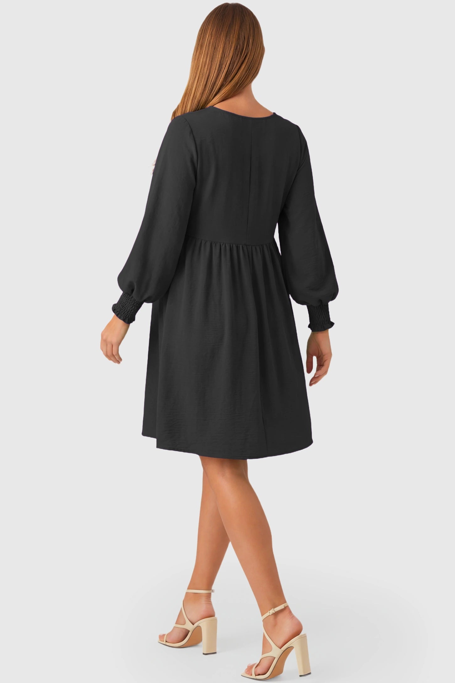 Balloon Sleeve Empire Waist Maternity Midi Dress Balloon Sleeve Empire Waist Maternity Midi Dress in black featuring smocked elastic cuff sleeves and soft drape on a pregnant model.