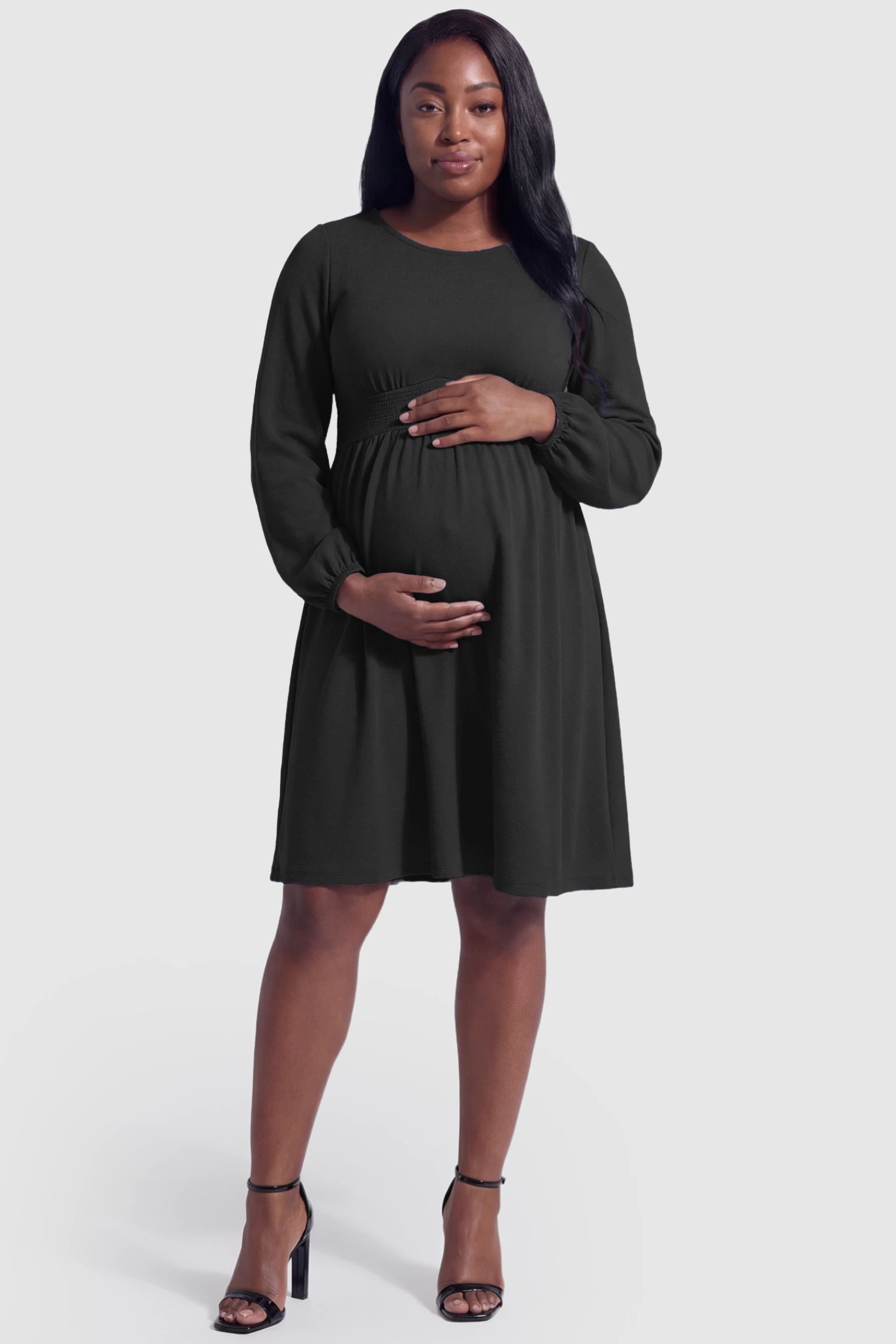 Balloon Sleeve Empire Waist Maternity Midi Dress Balloon Sleeve Empire Waist Maternity Midi Dress in black featuring smocked elastic cuff sleeves and soft drape on a plus size pregnant model.