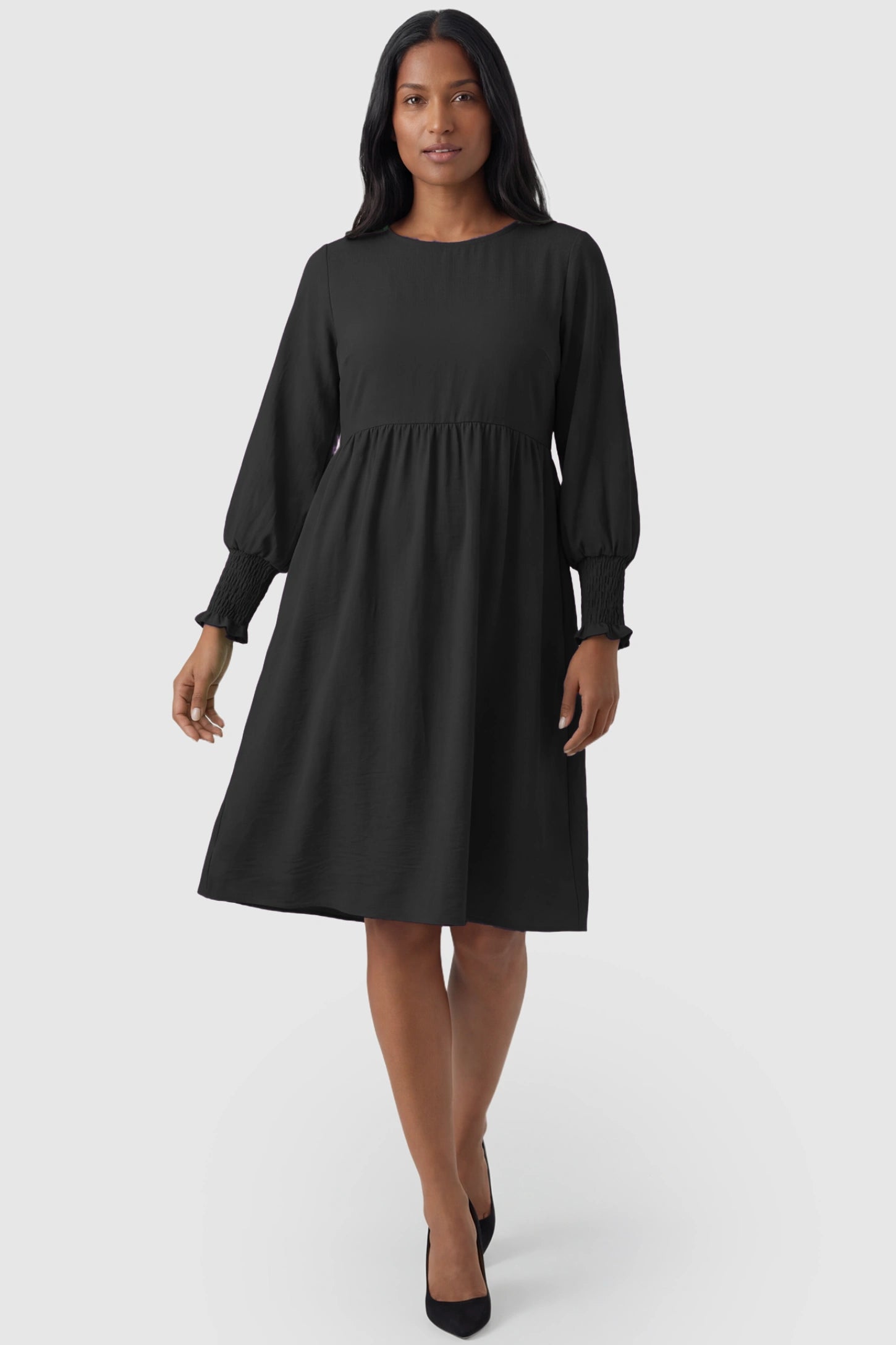Balloon Sleeve Empire Waist Maternity Midi Dress Balloon Sleeve Empire Waist Maternity Midi Dress in black featuring smocked elastic cuff sleeves and soft drape on a non pregnant model.