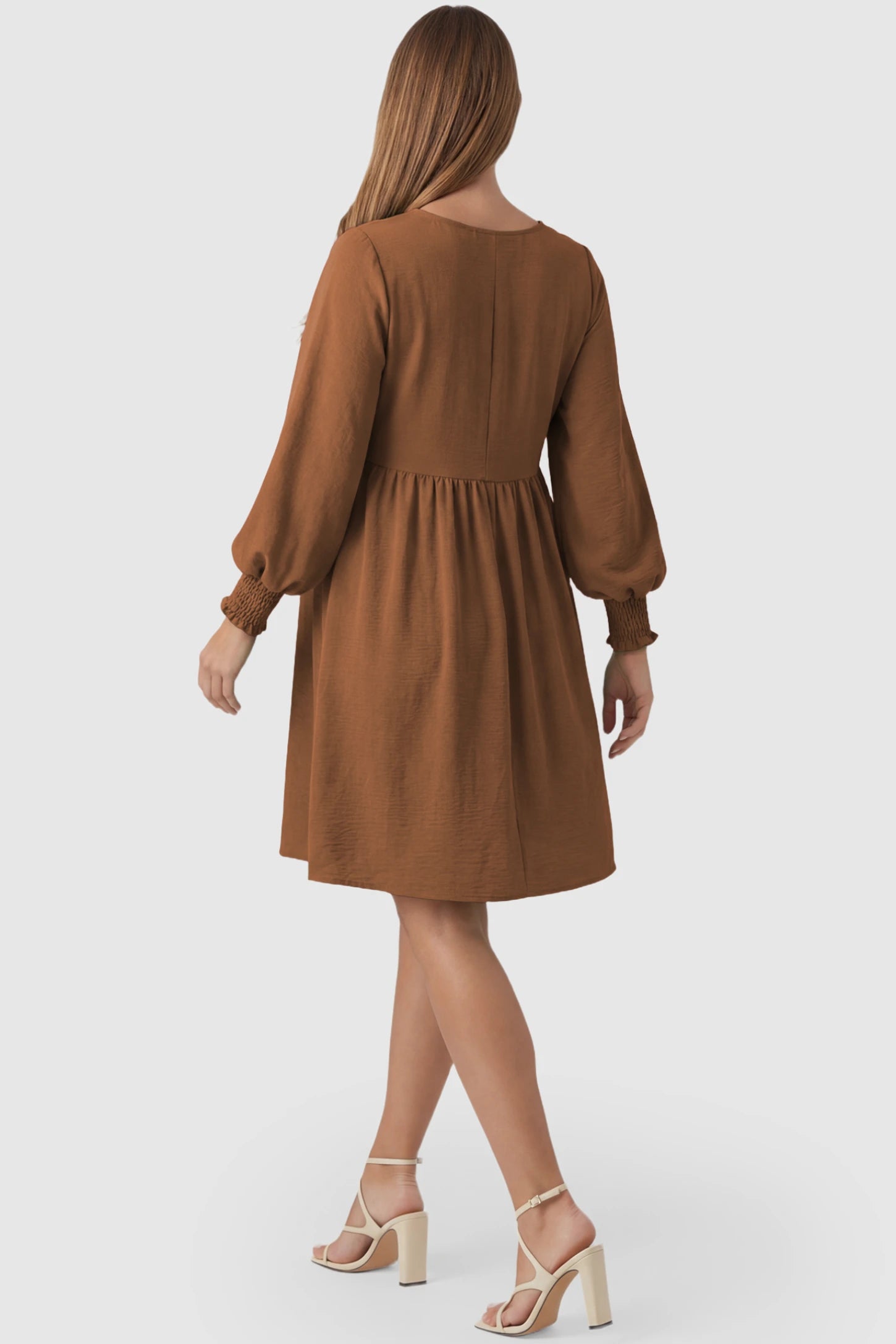 Balloon Sleeve Empire Waist Maternity Midi Dress Balloon Sleeve Empire Waist Maternity Midi Dress in dark brown featuring smocked elastic cuff sleeves and soft drape on a pregnant model, back view.