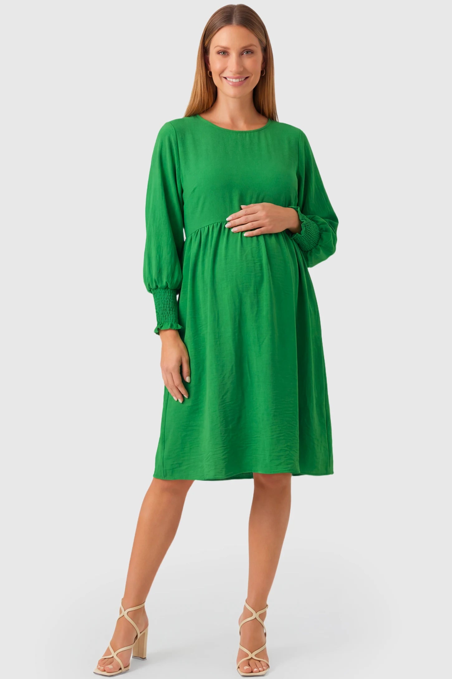 Balloon Sleeve Empire Waist Maternity Midi Dress Balloon Sleeve Empire Waist Maternity Midi Dress in green featuring smocked elastic cuff sleeves and soft drape on a pregnant model.