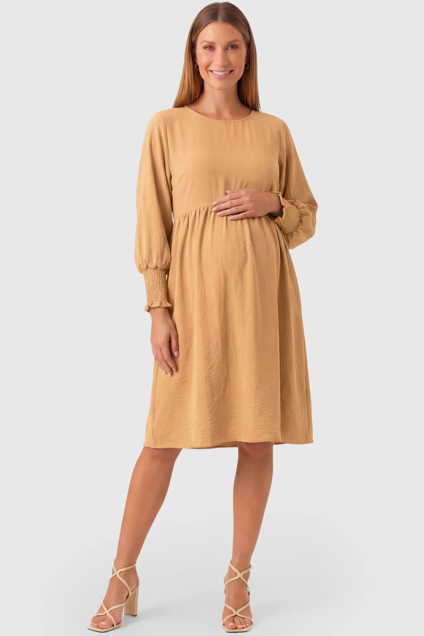 Balloon Sleeve Empire Waist Maternity Midi Dress Balloon Sleeve Empire Waist Maternity Midi Dress in khaki featuring smocked elastic cuff sleeves and soft drape on a pregnant model.