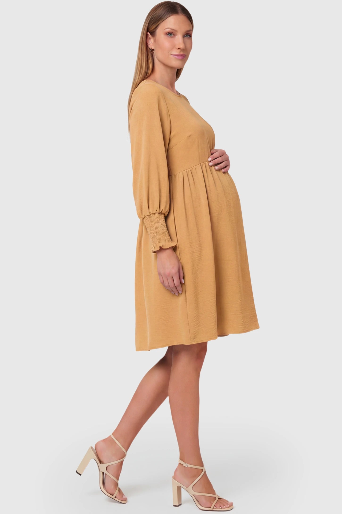 Balloon Sleeve Empire Waist Maternity Midi Dress Balloon Sleeve Empire Waist Maternity Midi Dress in khaki featuring smocked elastic cuff sleeves and soft drape on a pregnant model.