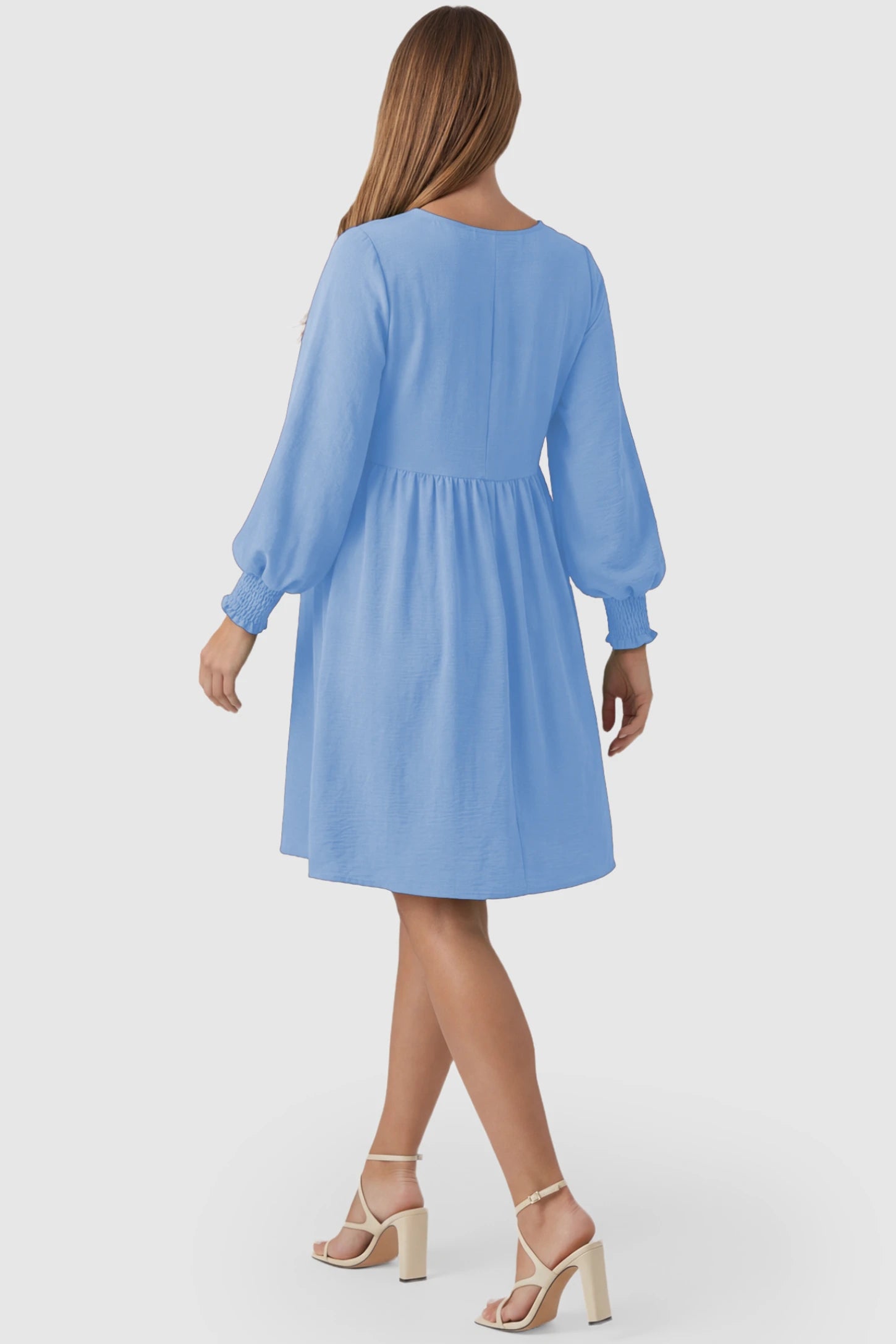Balloon Sleeve Empire Waist Maternity Midi Dress Balloon Sleeve Empire Waist Maternity Midi Dress in light blue featuring smocked elastic cuff sleeves and soft drape on a pregnant model, back view.