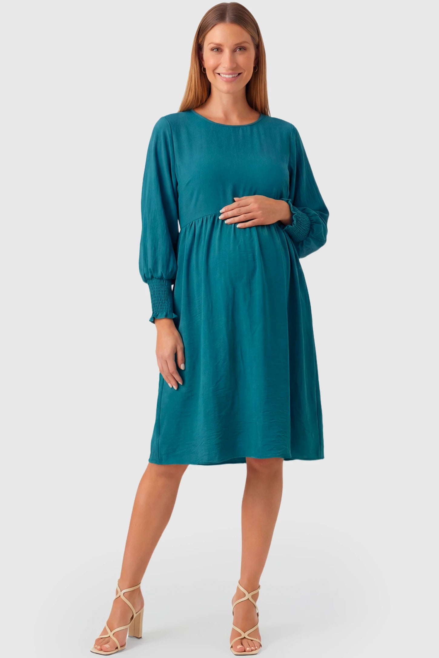 Balloon Sleeve Empire Waist Maternity Midi Dress Balloon Sleeve Empire Waist Maternity Midi Dress in peacock blue featuring smocked elastic cuff sleeves and soft drape on a pregnant model.