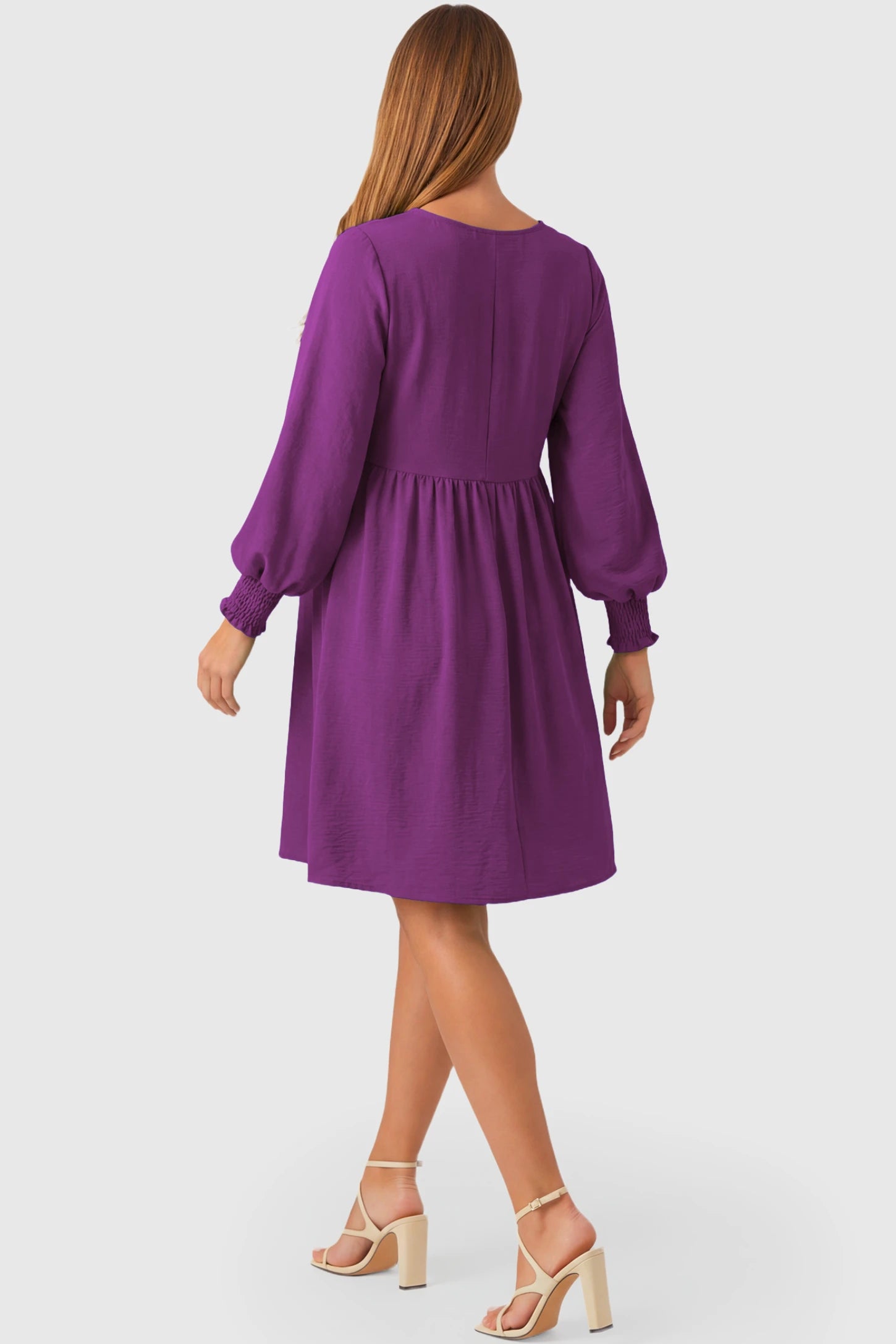 Balloon Sleeve Empire Waist Maternity Midi Dress Balloon Sleeve Empire Waist Maternity Midi Dress in purple featuring smocked elastic cuff sleeves and soft drape on a pregnant model.