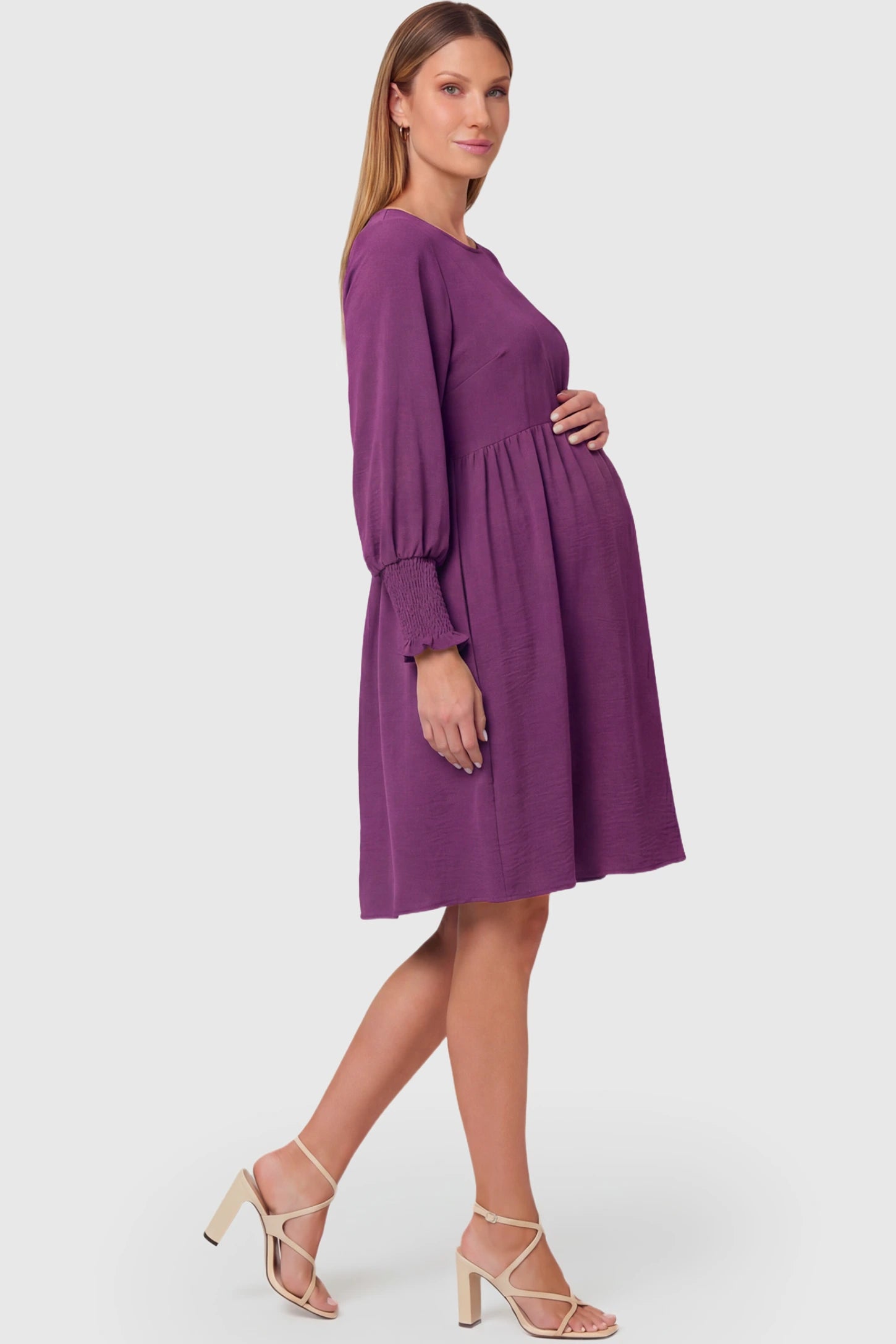 Balloon Sleeve Empire Waist Maternity Midi Dress Balloon Sleeve Empire Waist Maternity Midi Dress in purple featuring smocked elastic cuff sleeves and soft drape on a pregnant model.
