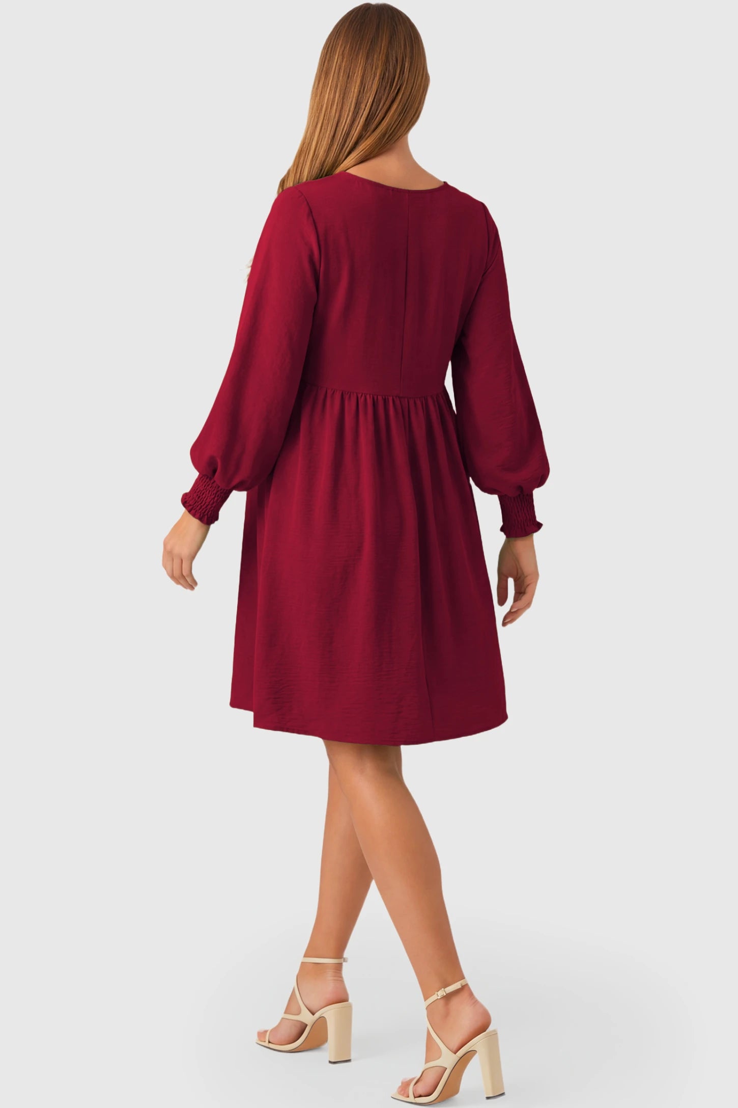 Balloon Sleeve Empire Waist Maternity Midi Dress Balloon Sleeve Empire Waist Maternity Midi Dress in red featuring smocked elastic cuff sleeves and soft drape on a pregnant model.