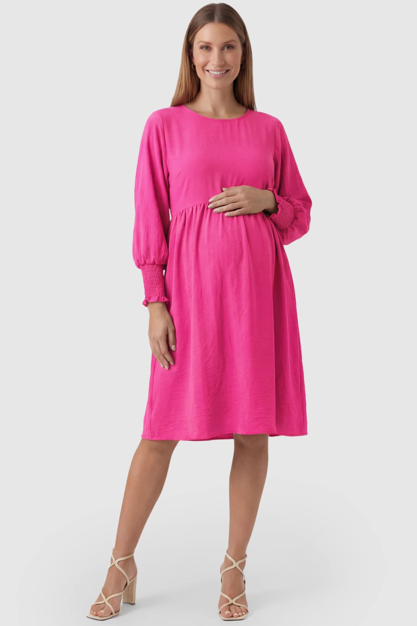 Balloon Sleeve Empire Waist Maternity Midi Dress Balloon Sleeve Empire Waist Maternity Midi Dress in rose red featuring smocked elastic cuff sleeves and soft drape on a pregnant model, front view.