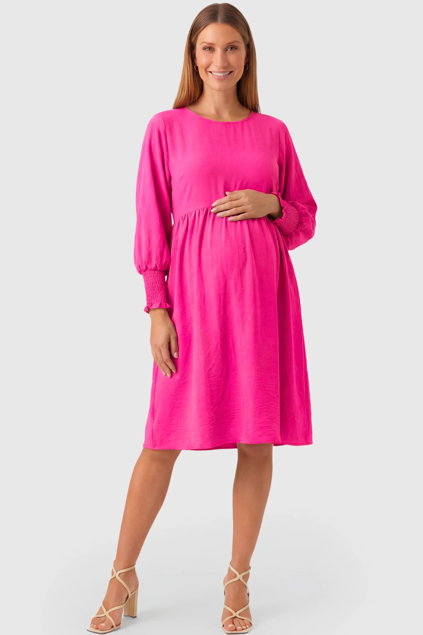 Balloon Sleeve Empire Waist Maternity Midi Dress Balloon Sleeve Empire Waist Maternity Midi Dress in rose red featuring smocked elastic cuff sleeves and soft drape on a pregnant model.