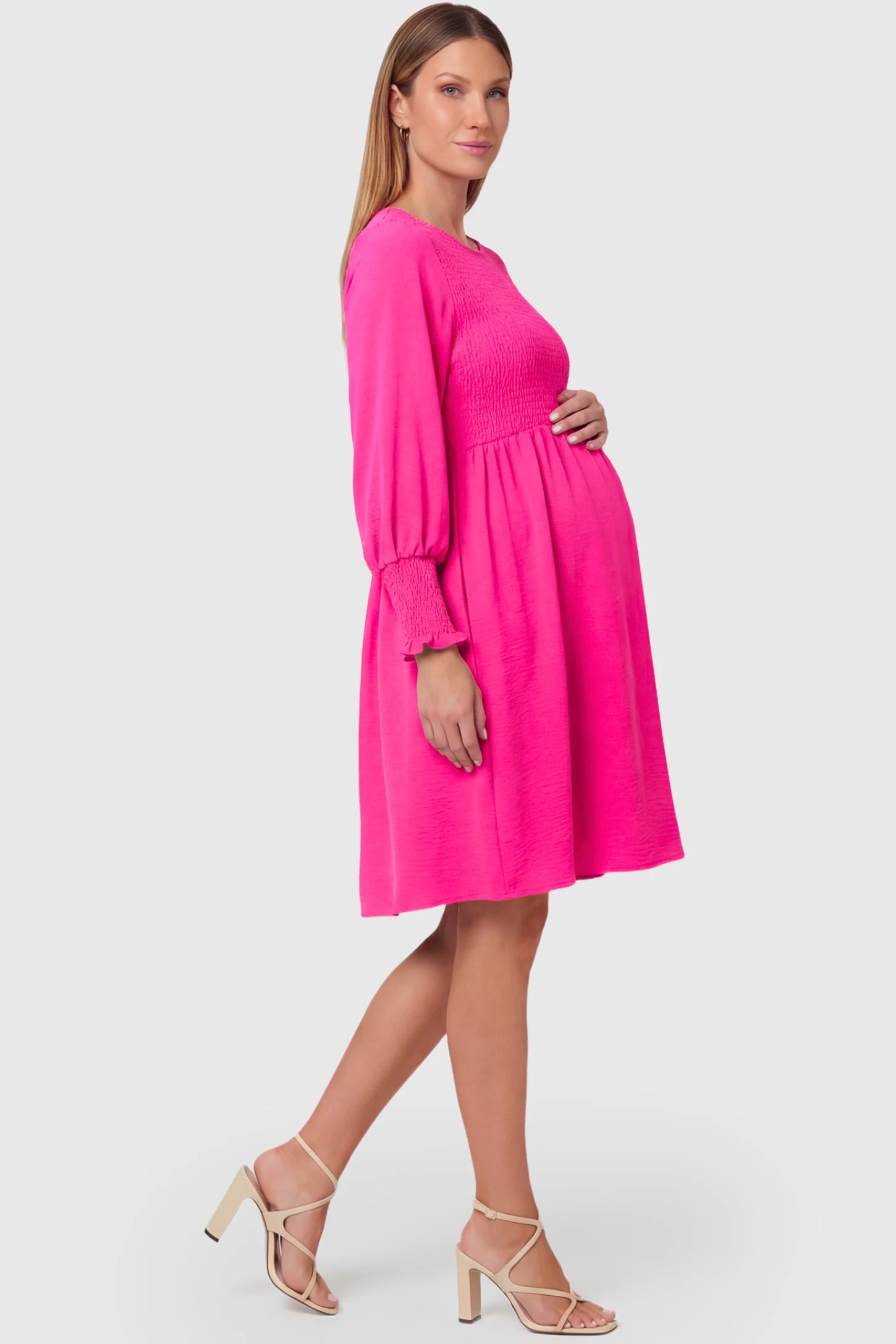 Balloon Sleeve Empire Waist Maternity Midi Dress Balloon Sleeve Empire Waist Maternity Midi Dress in rose red featuring smocked elastic cuff sleeves and soft drape on a pregnant model.