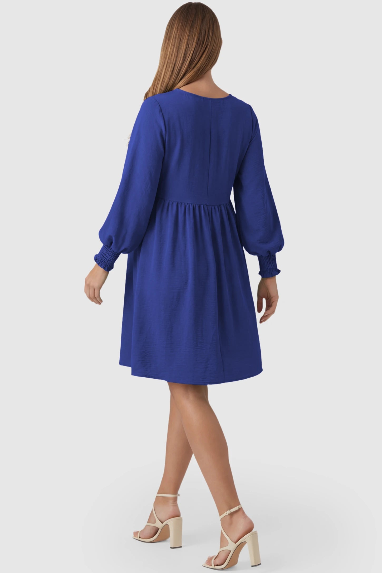 Balloon Sleeve Empire Waist Maternity Midi Dress Balloon Sleeve Empire Waist Maternity Midi Dress in blue featuring smocked elastic cuff sleeves and soft drape on a pregnant model, back view.