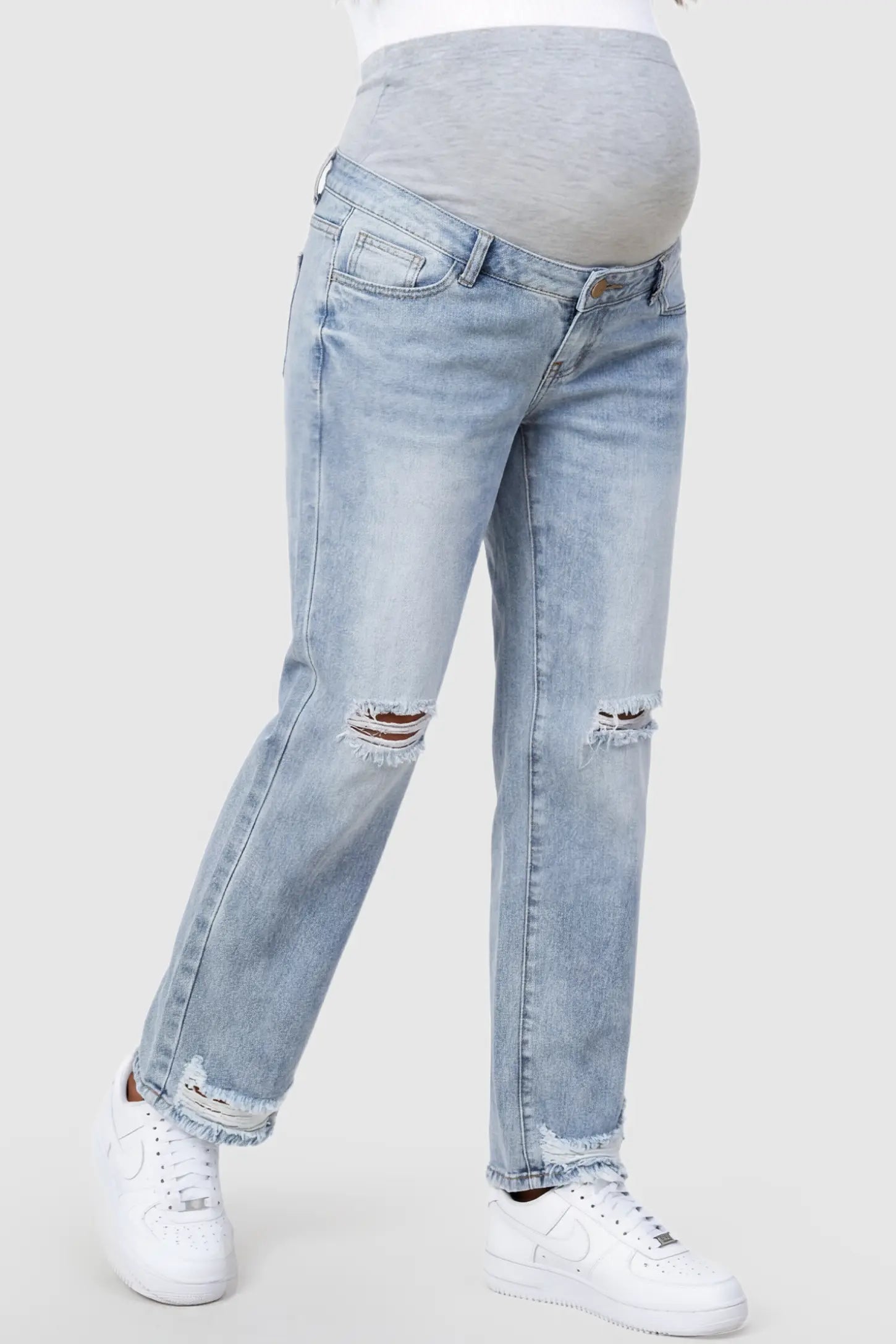 Distressed Straight-Leg Maternity Jeans in light blue featuring knee-ripped detailing and frayed hem on pregnant model.