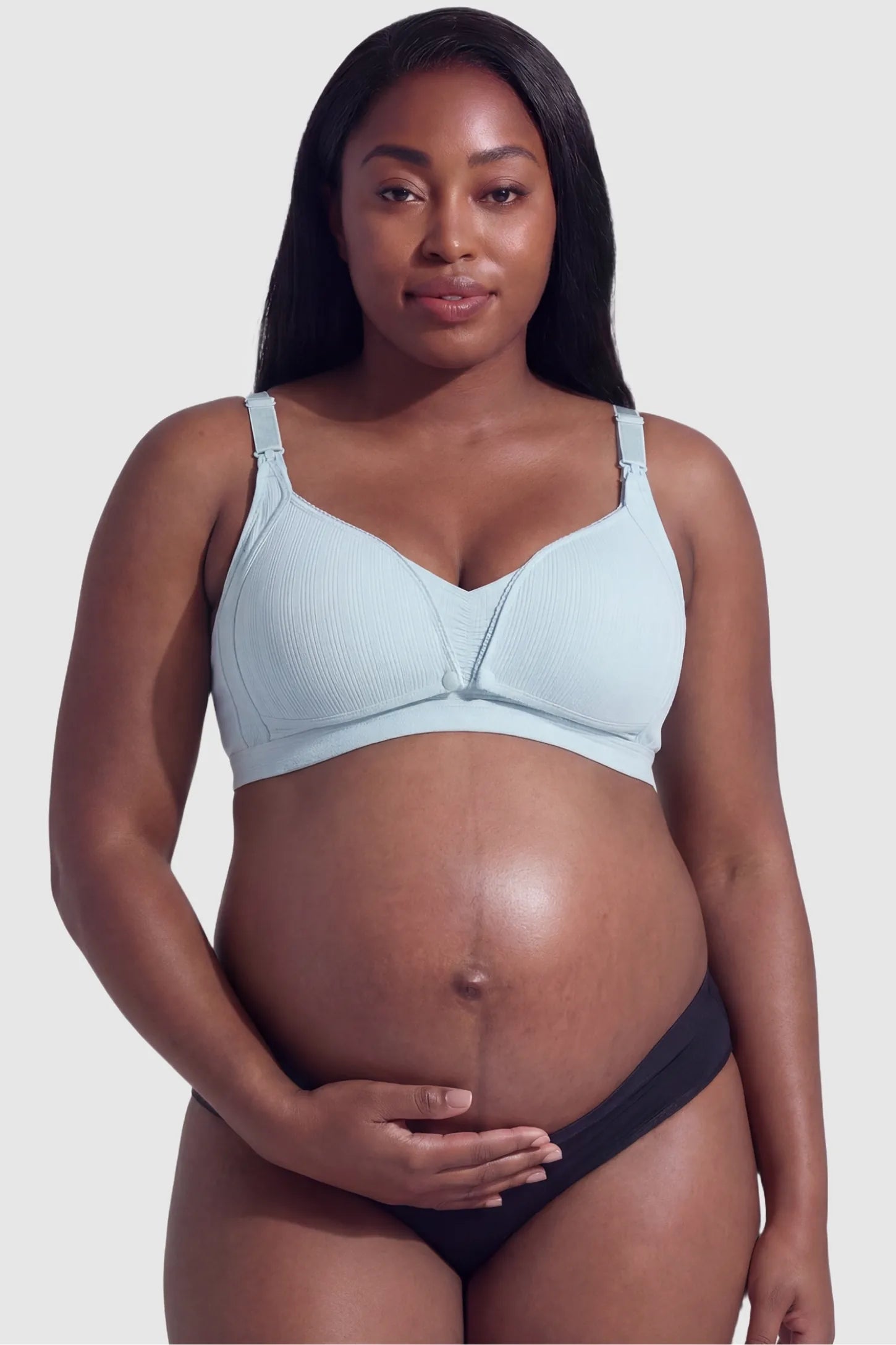 Front-Open Snap Wire-Free Maternity Nursing Bra Front-Open Buckle Wire-Free Maternity Nursing Bra in Blue featuring supportive wire-free cups on a front view of a plus size pregnant model.
