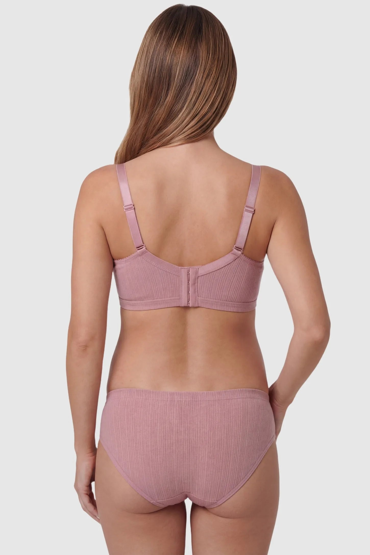 Front-Open Snap Wire-Free Maternity Nursing Bra Front-Open Buckle Wire-Free Maternity Nursing Bra in Dusty Rose featuring rear four-row buckles on a back view of a pregnant model.