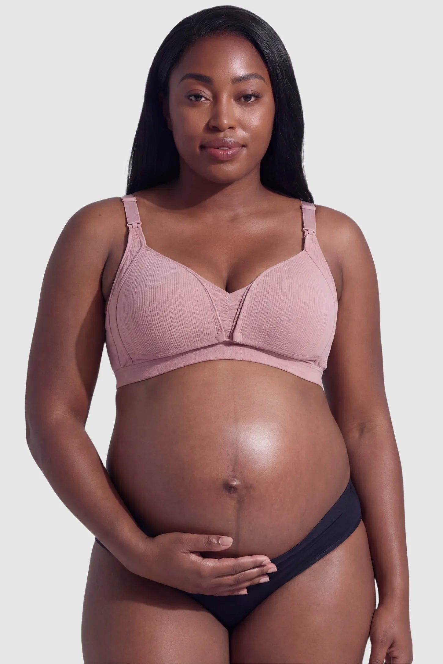 Front-Open Snap Wire-Free Maternity Nursing Bra Front-Open Buckle Wire-Free Maternity Nursing Bra in Dusty Rose featuring supportive wire-free cups on a front view of a plus size pregnant model.