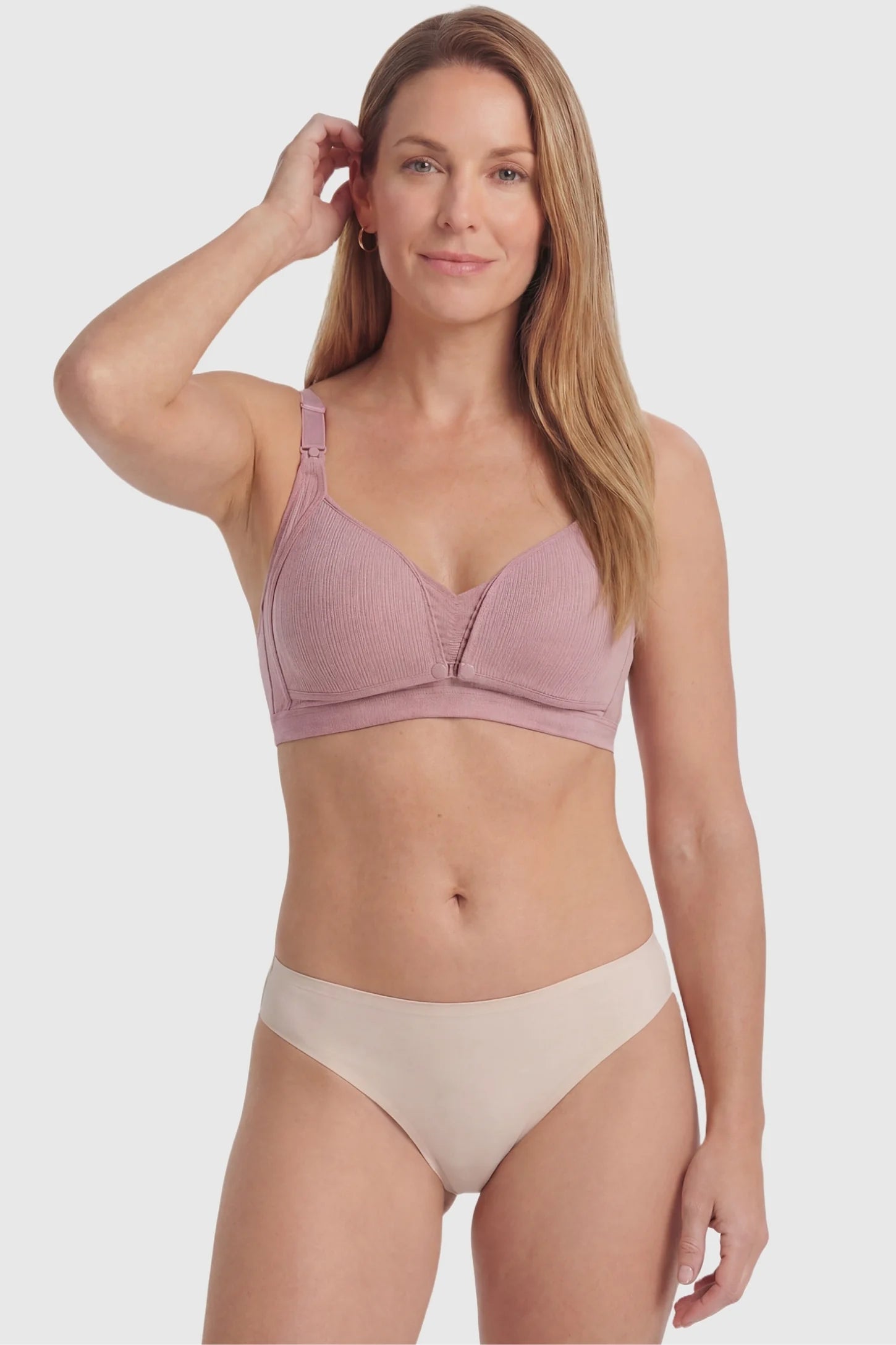 Front-Open Snap Wire-Free Maternity Nursing Bra Front-Open Snap Wire-Free Maternity Nursing Bra in Dusty Rose featuring a soft stretch band on a postpartum model, front view.