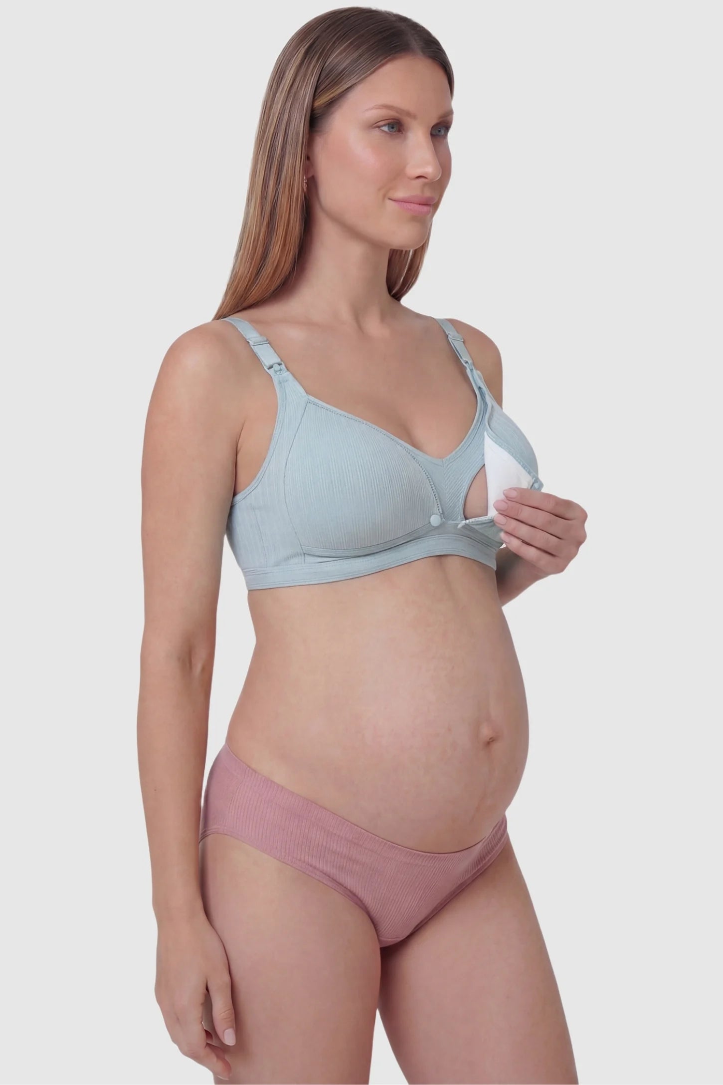 Front-Open Snap Wire-Free Maternity Nursing Bra Front-Open Buckle Wire-Free Maternity Nursing Bra in Green featuring breathable cotton fabric on a side view of a pregnant model.