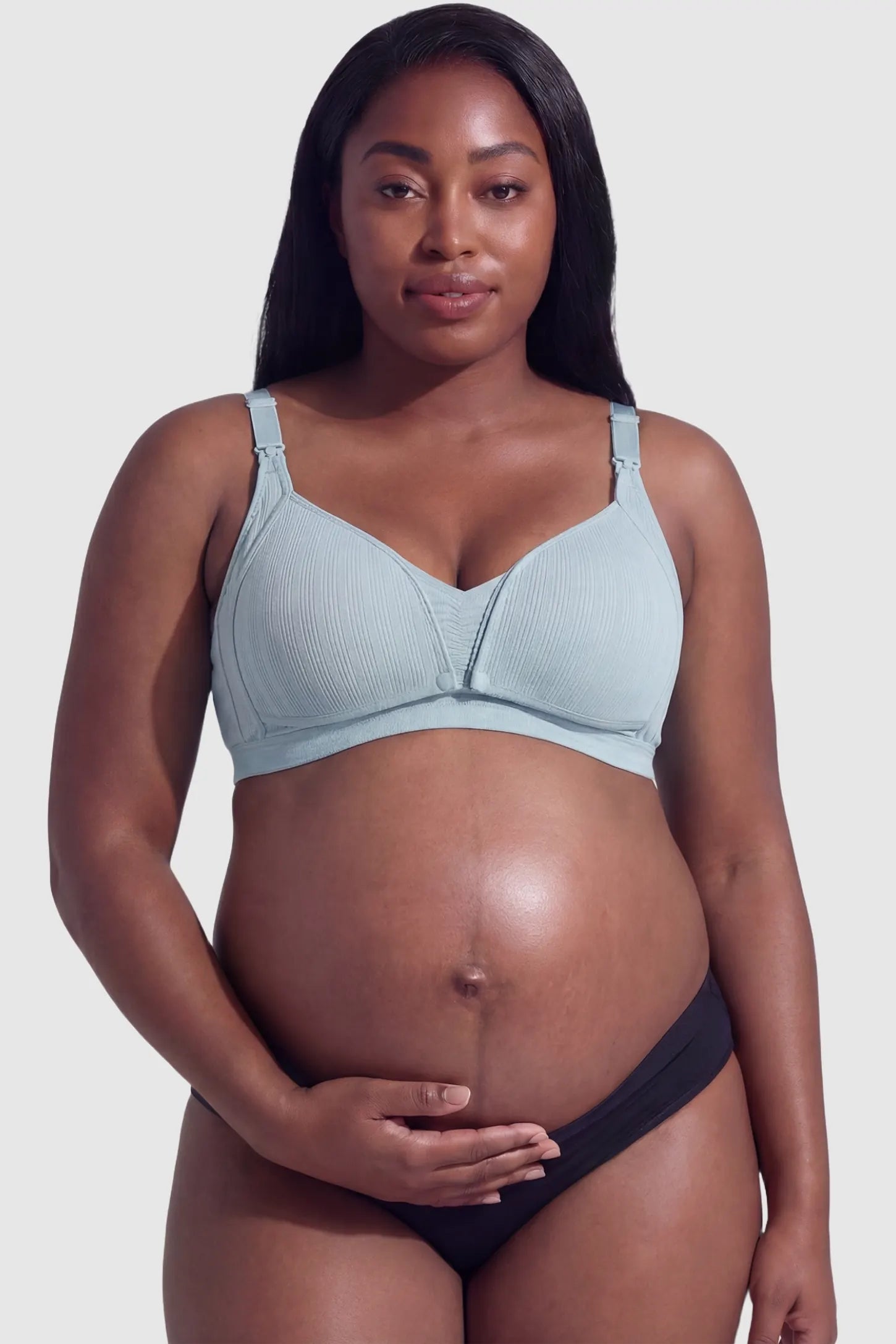 Front-Open Snap Wire-Free Maternity Nursing Bra Front-Open Buckle Wire-Free Maternity Nursing Bra in Green featuring supportive wire-free cups on a front view of a plus size pregnant model.