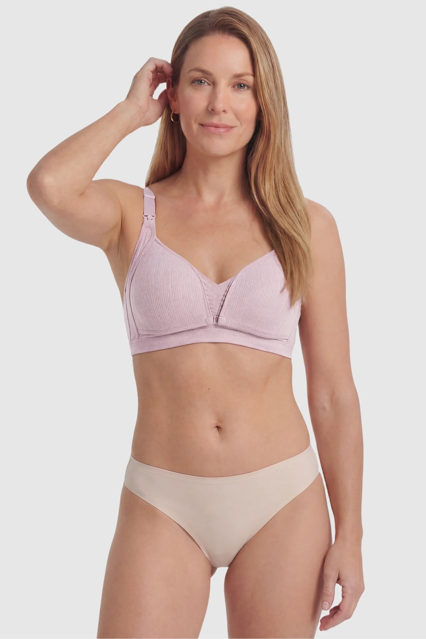 Front-Open Snap Wire-Free Maternity Nursing Bra Front-Open Snap Wire-Free Maternity Nursing Bra in Pink featuring front-snap buckles for easy feeding on a postpartum model, front view.