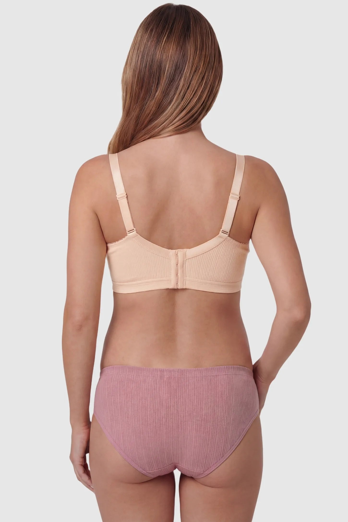Front-Open Snap Wire-Free Maternity Nursing Bra Front-Open Buckle Wire-Free Maternity Nursing Bra in Skin featuring rear four-row buckles on a back view of a pregnant model.