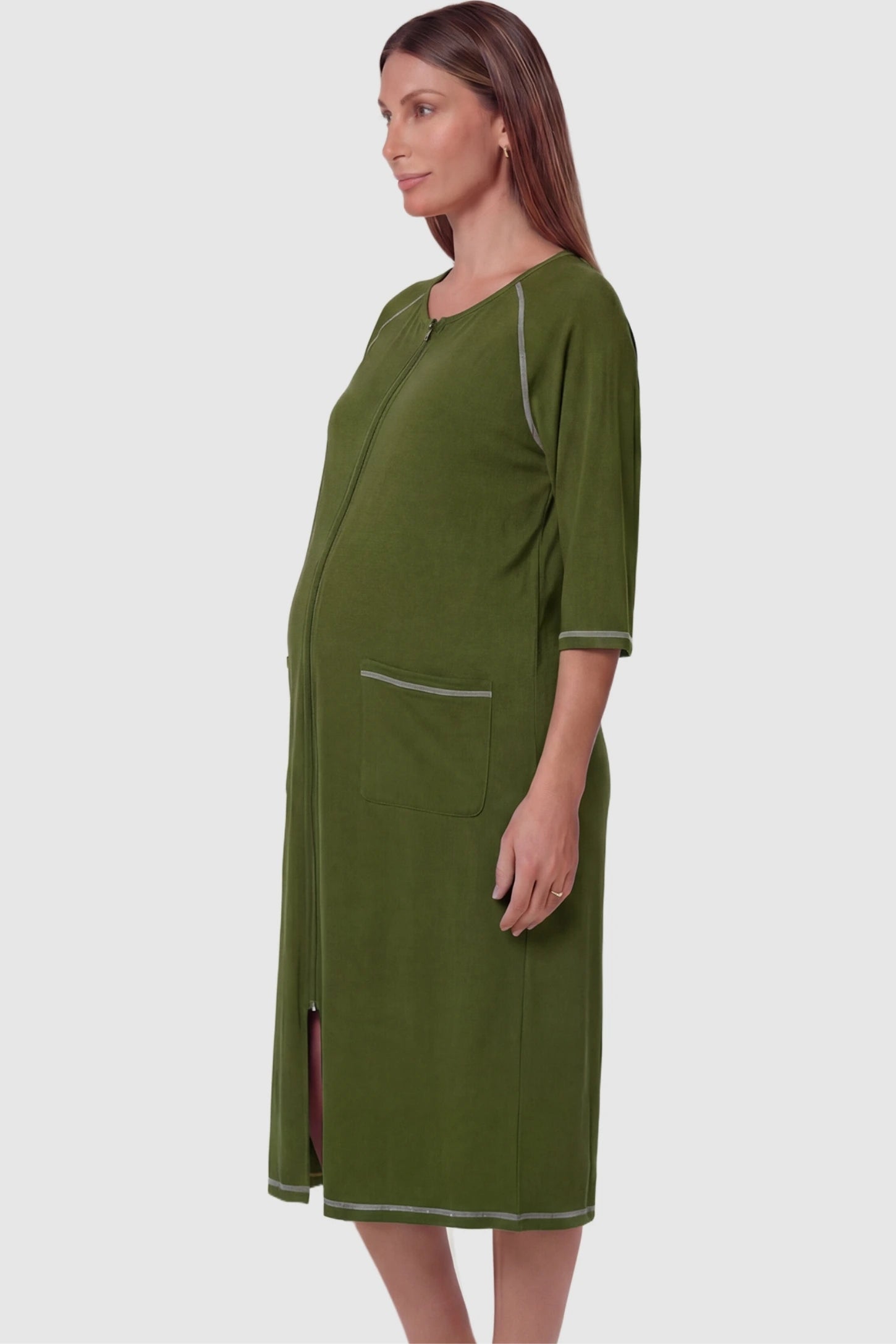 Front Zipper Three-Quarter Sleeve Midi Maternity & Nursing Dress Front zipper three-quarter sleeve midi maternity and nursing dress in army green featuring functional pockets and three-quarter sleeves in side view on a pregnant model