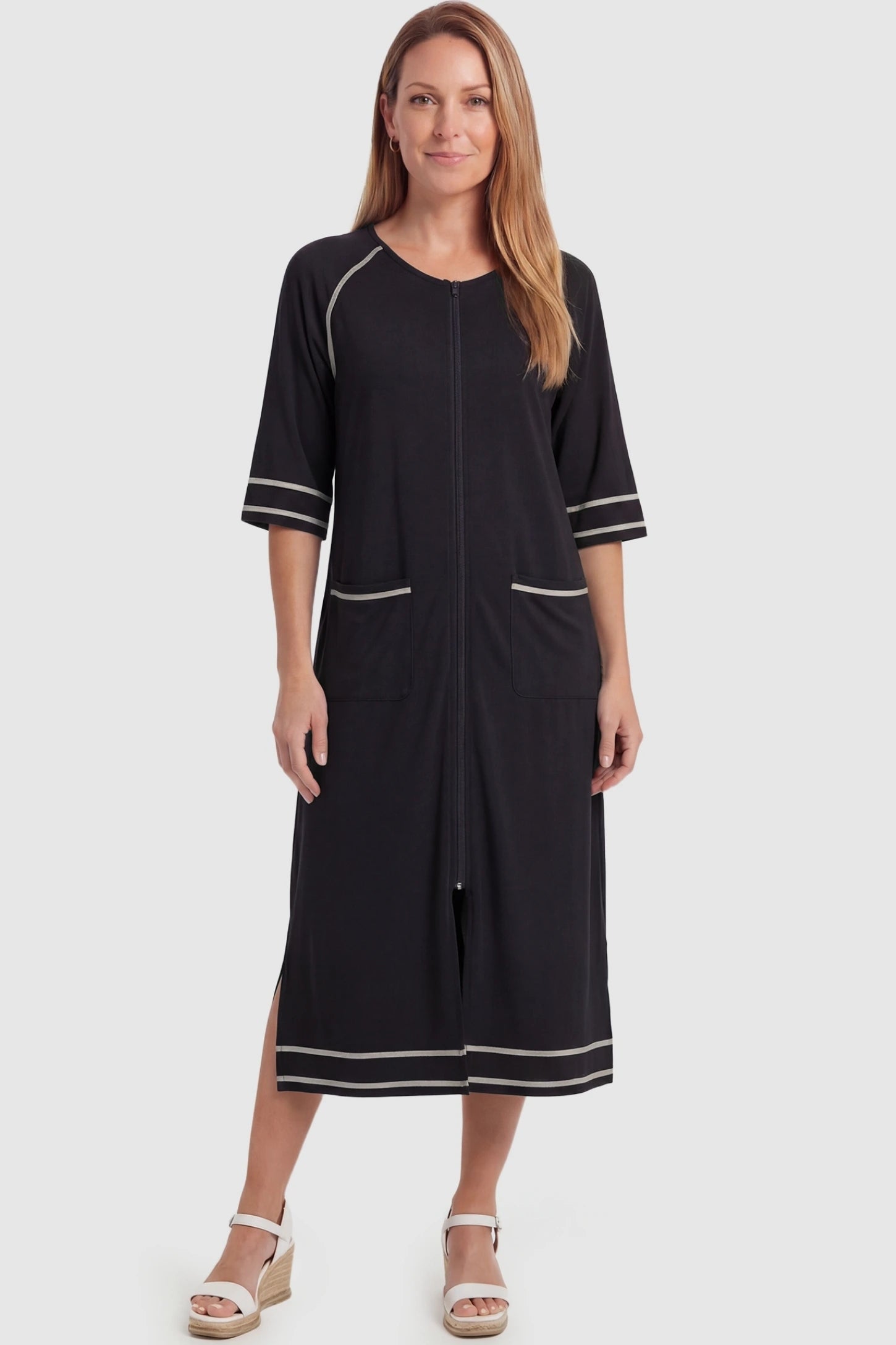 Front Zipper Three-Quarter Sleeve Midi Maternity & Nursing Dress Front zipper three-quarter sleeve midi maternity and nursing dress in black featuring front zipper and pockets in full body view on a postpartum model