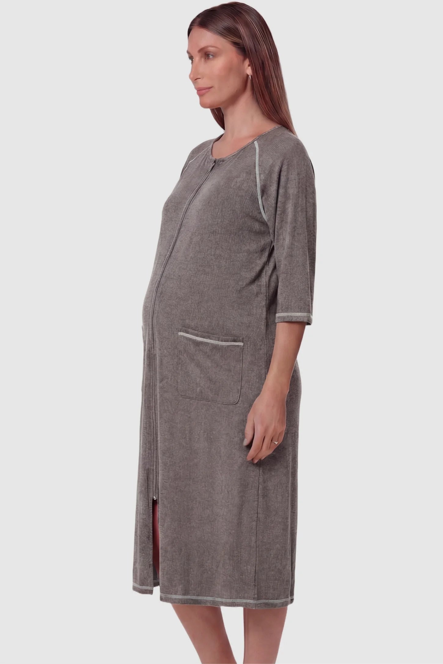 Front Zipper Three-Quarter Sleeve Midi Maternity & Nursing Dress Front zipper three-quarter sleeve midi maternity and nursing dress in dark gray featuring functional pockets and three-quarter sleeves in side view on a pregnant model