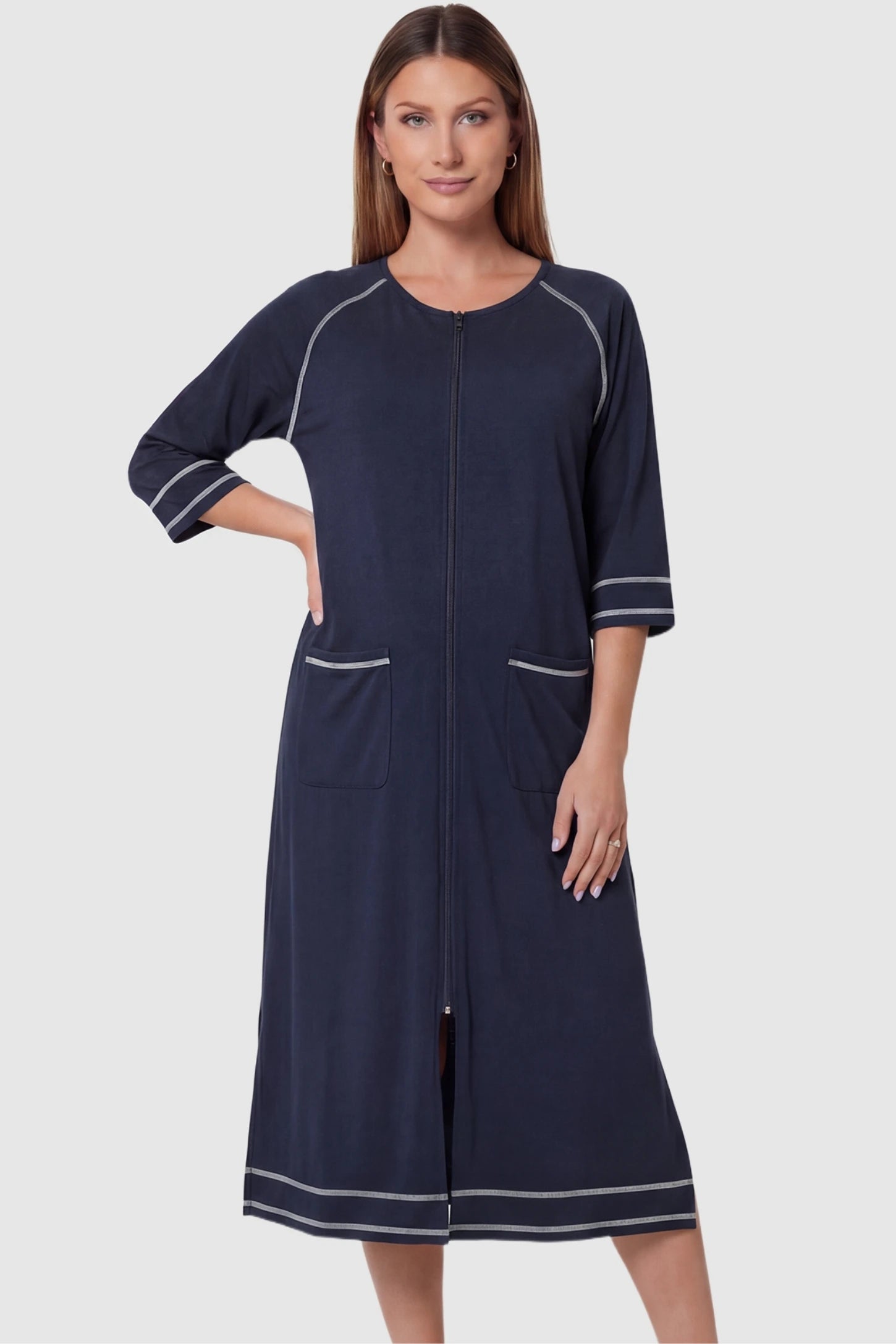 Front zipper three-quarter sleeve midi maternity and nursing dress in navy blue featuring convenient nursing zipper access in front view on a pregnant model