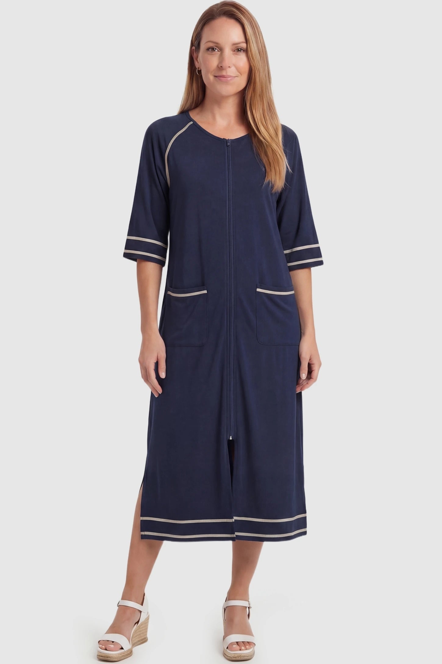 Front Zipper Three-Quarter Sleeve Midi Maternity & Nursing Dress Front zipper three-quarter sleeve midi maternity and nursing dress in navy blue featuring front zipper and pockets in full body view on a postpartum model