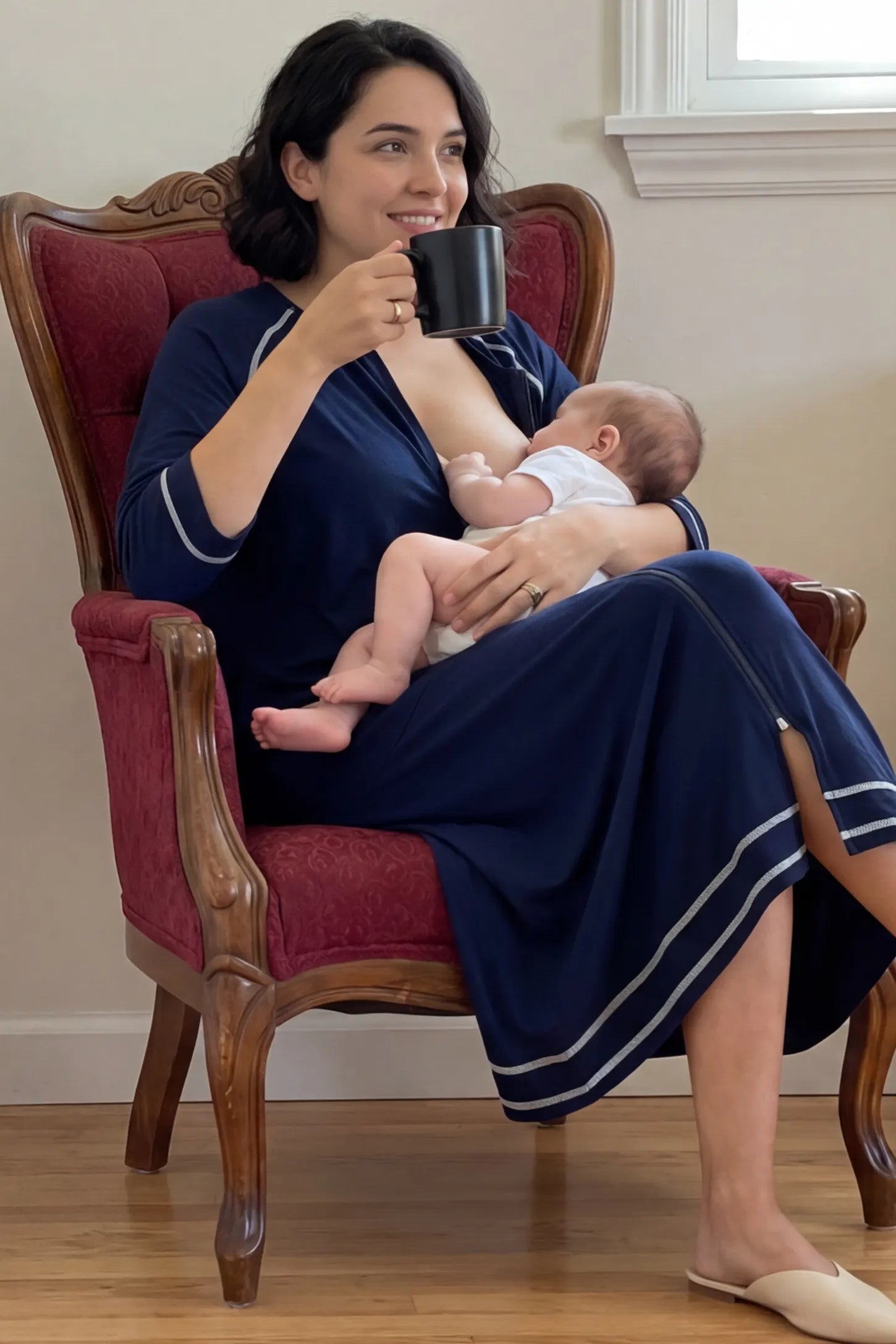 Front Zipper Three-Quarter Sleeve Midi Maternity & Nursing Dress Front zipper three-quarter sleeve midi maternity and nursing dress in navy blue featuring easy nursing access in front view on a UGC model