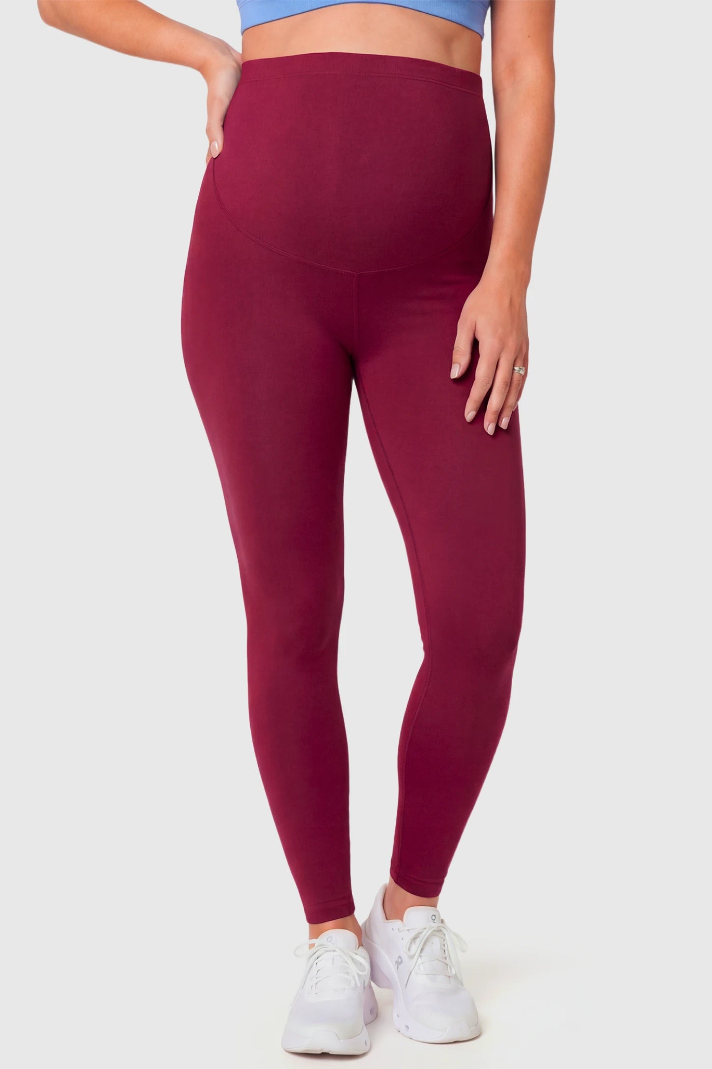 Full-Panel Ankle-Length Maternity Yoga Leggings Full-Panel Ankle-Length Maternity Yoga Leggings in brick red featuring over-the-belly support and full-length fit on pregnant model.
